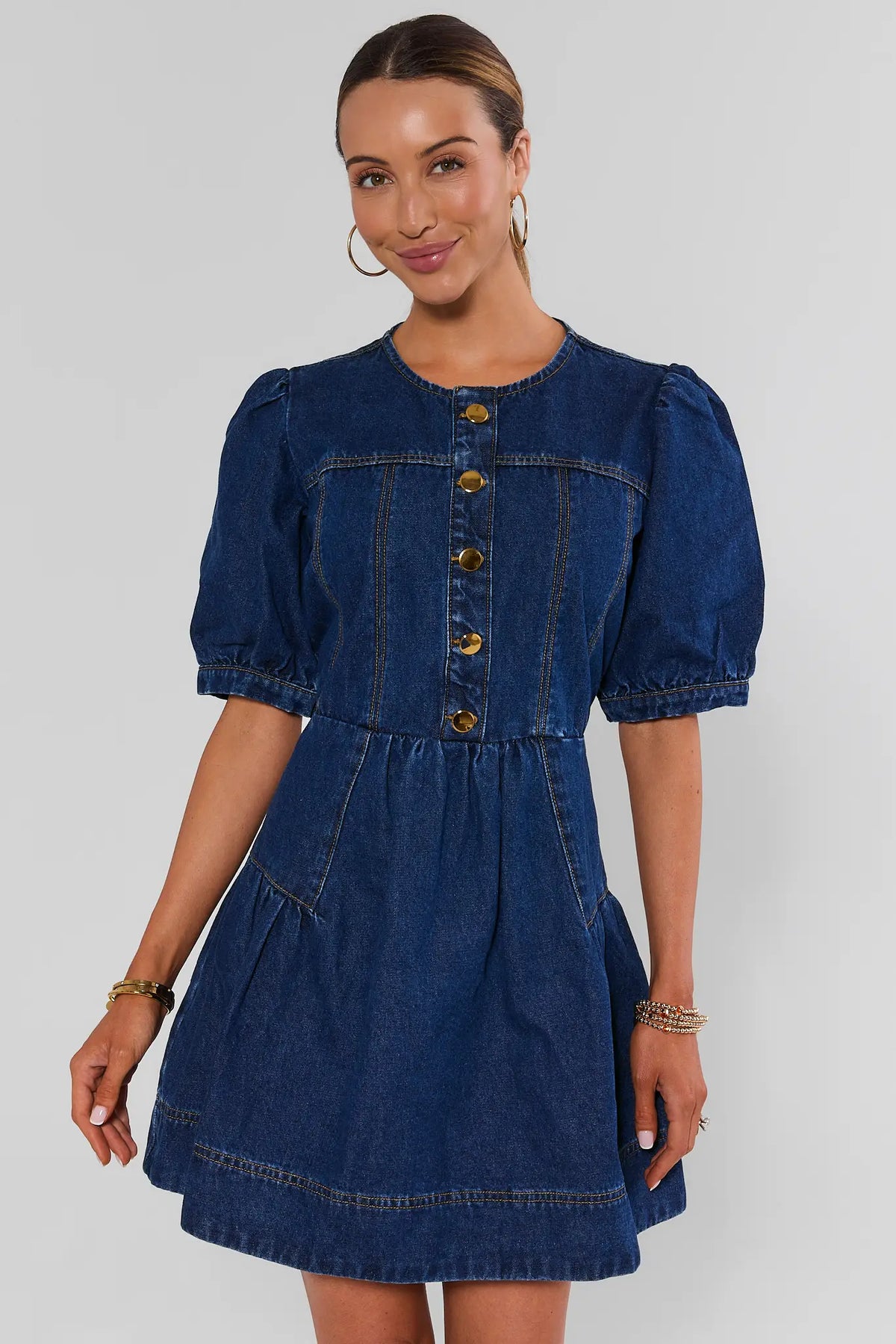 Dark denim puff-sleeve short dress with gold buttons and round neckline - Front View | Avara