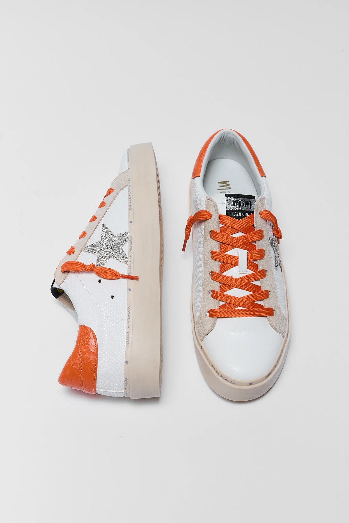 White and Silver Star Sneakers with orange laces and heel - Top & Side View | Avara
