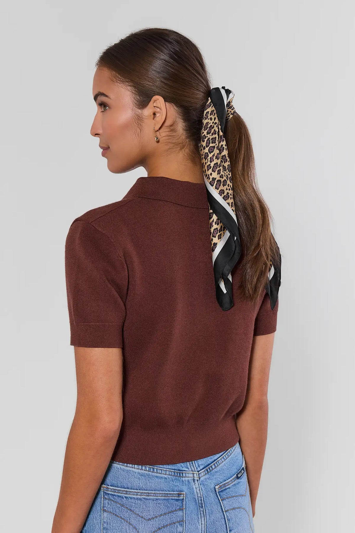 Ada Brown Knit Short Sleeve Top back view showing clean knit finish, paired with light-wash jeans | Avara