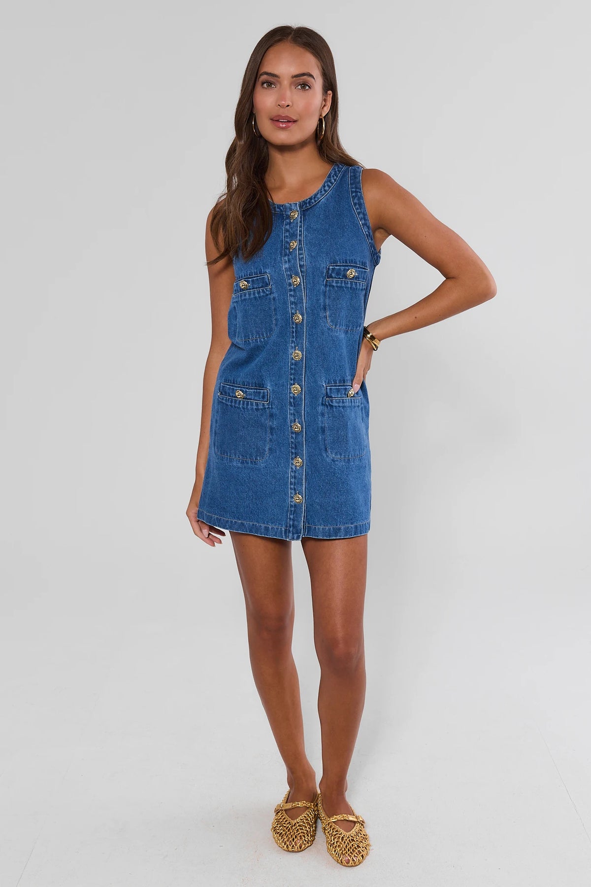 Blue denim button-up short dress with gold buttons paired with woven flats - Full Length Front View | Avara