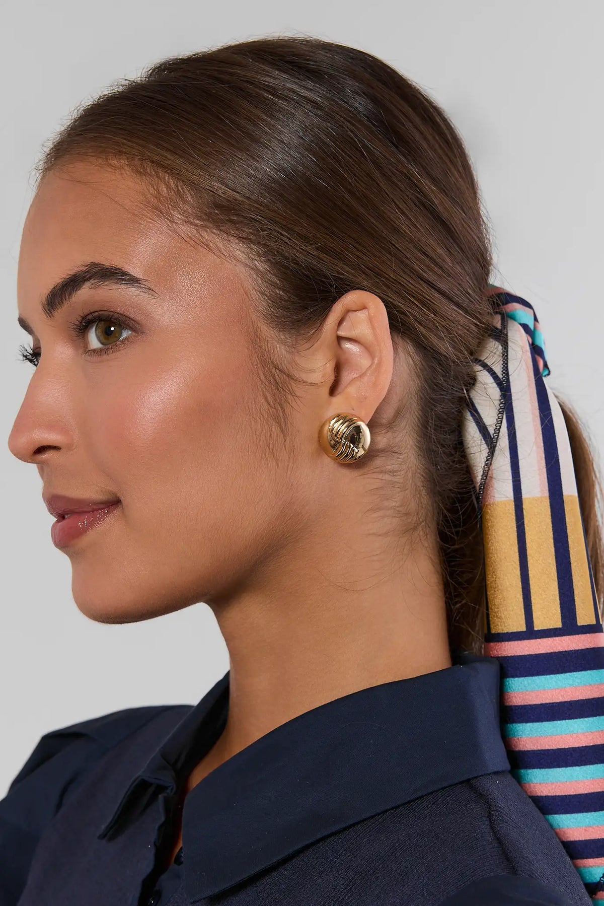 Gold Textured Stud Earrings on Model - Side Profile Close-Up, Women's Gold Studs | Avara