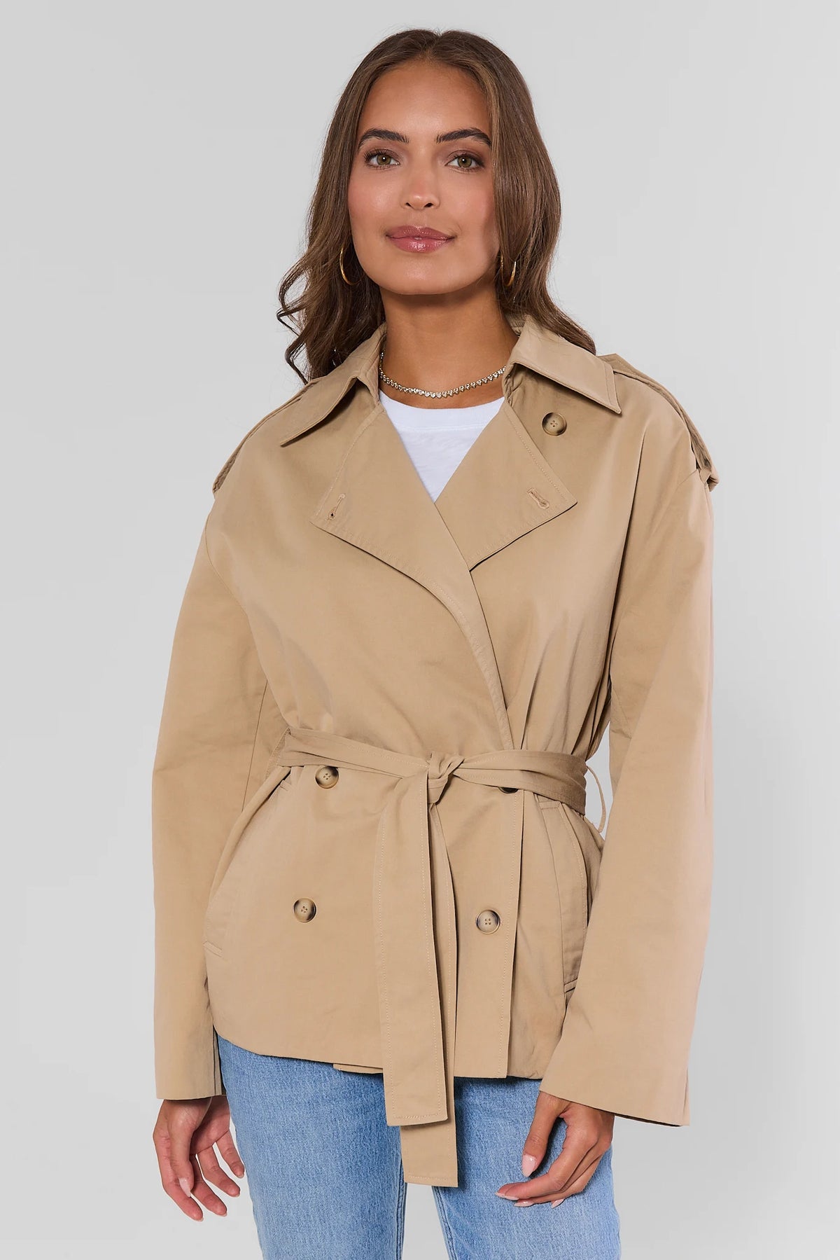 Tan Belted Short Trench Coat - Front View On Model with Notch Collar and Epaulette Detail | Avara