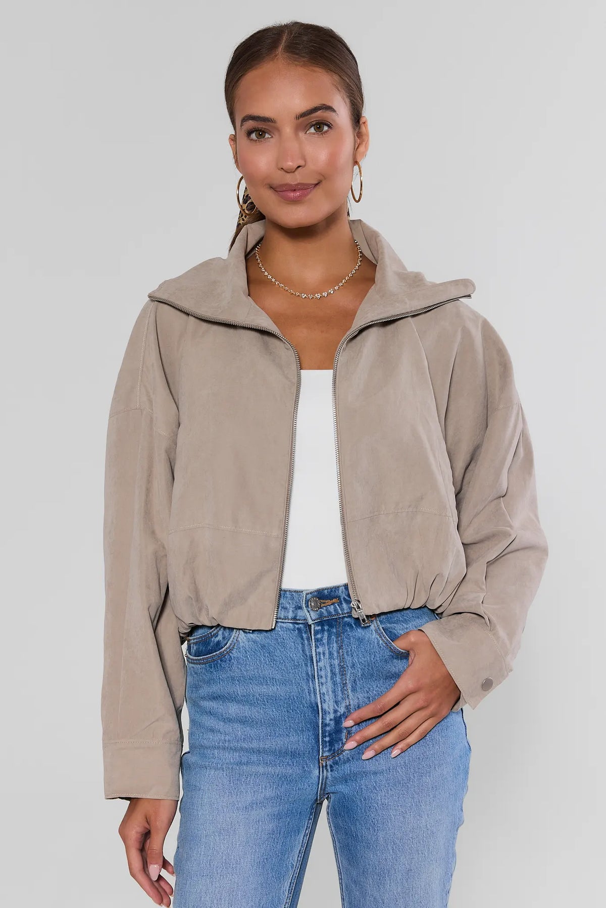 Tan Faux Suede Zip Up Jacket, front view, worn open over white top with blue jeans - women's outerwear | Avara