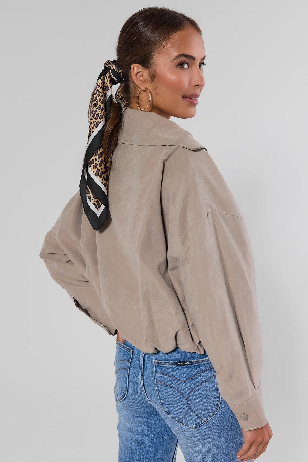 Tan Faux Suede Zip Up Jacket, back view showing cropped hem and faux suede finish, styled with blue jeans | Avara