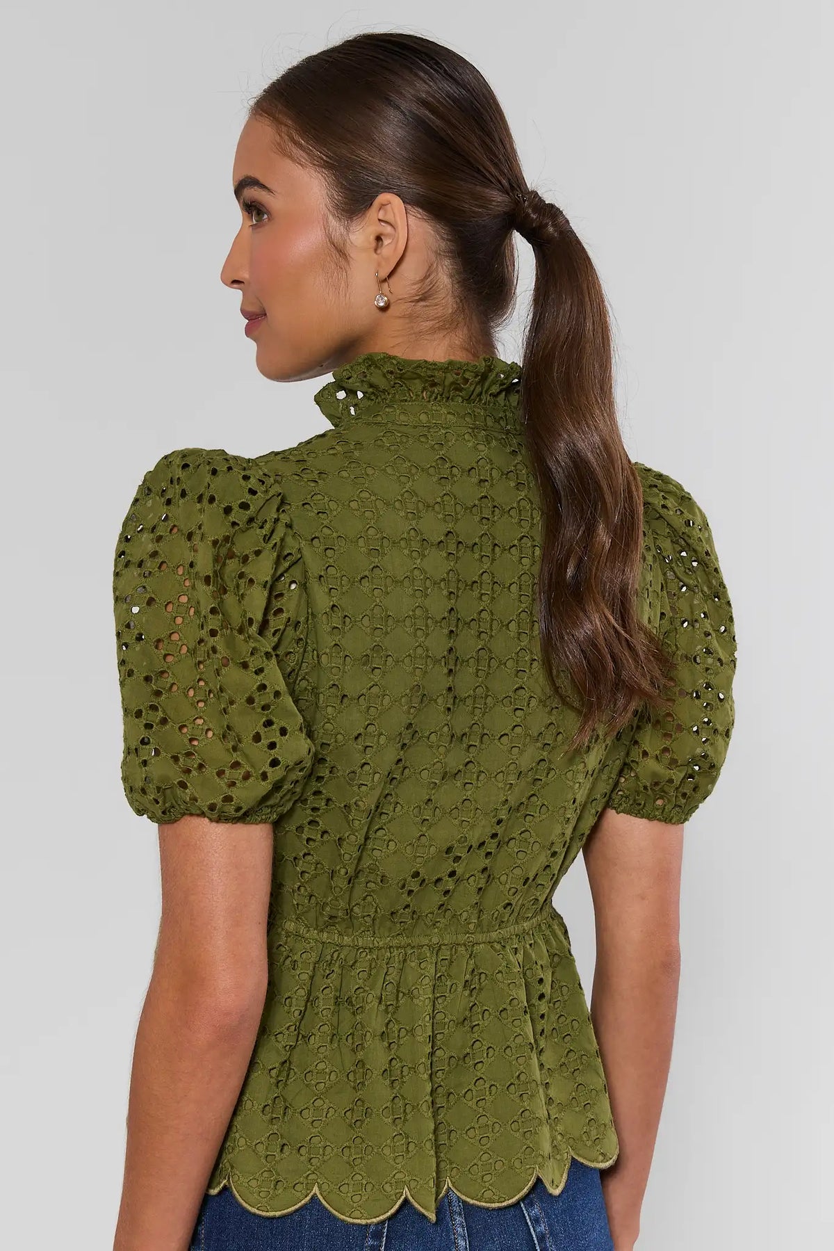 Olive green eyelet peplum top showing ruffle high neckline and scalloped hem - Back View | Avara