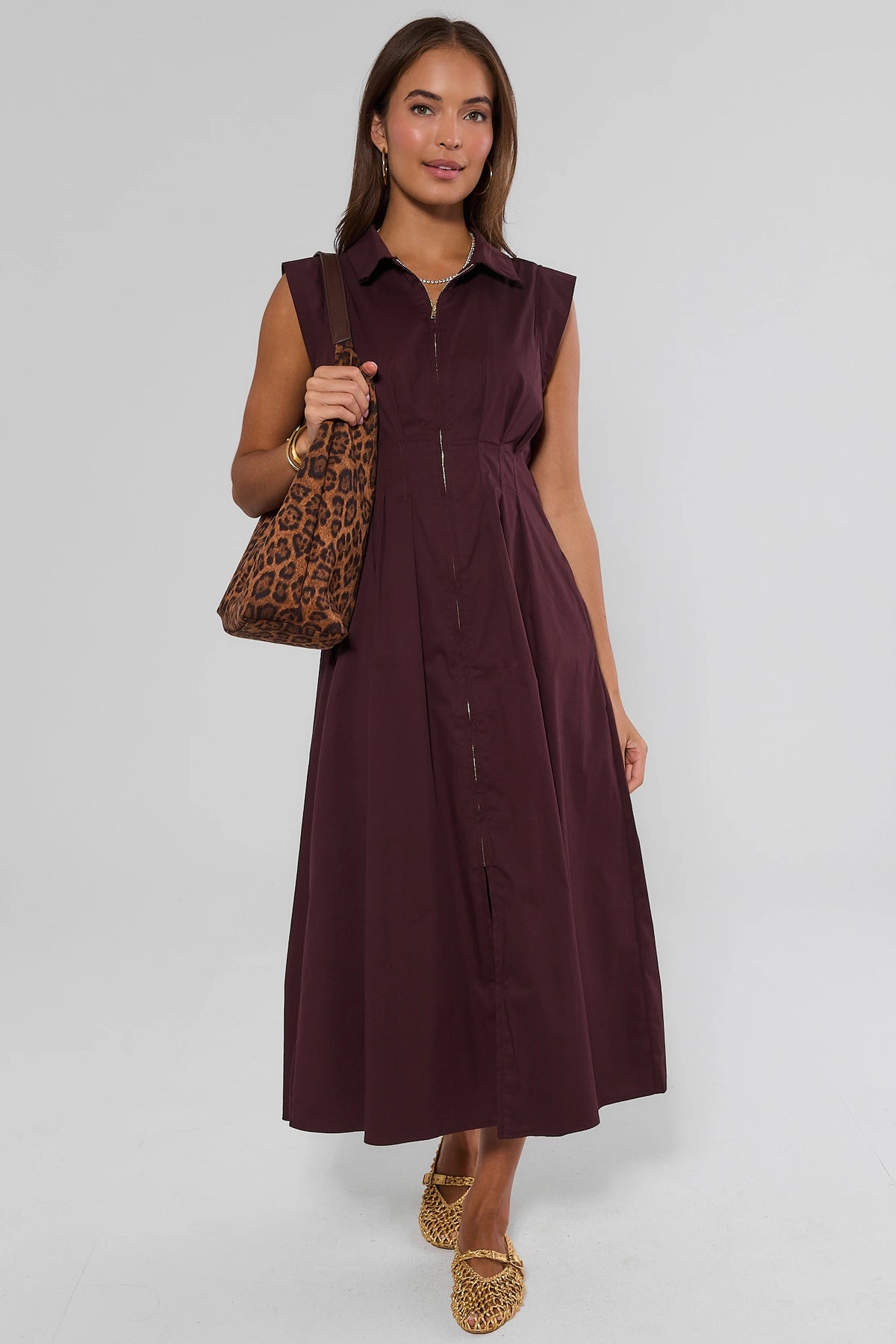 Burgundy zip-up midi dress styled with leopard tote bag and woven flats, full-length front view | Avara