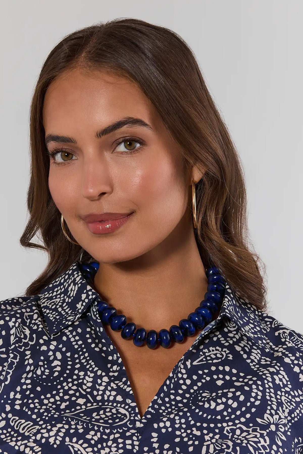 Navy Blue Beaded Necklace On Model with Gold Hoop Earrings - Front View | Avara