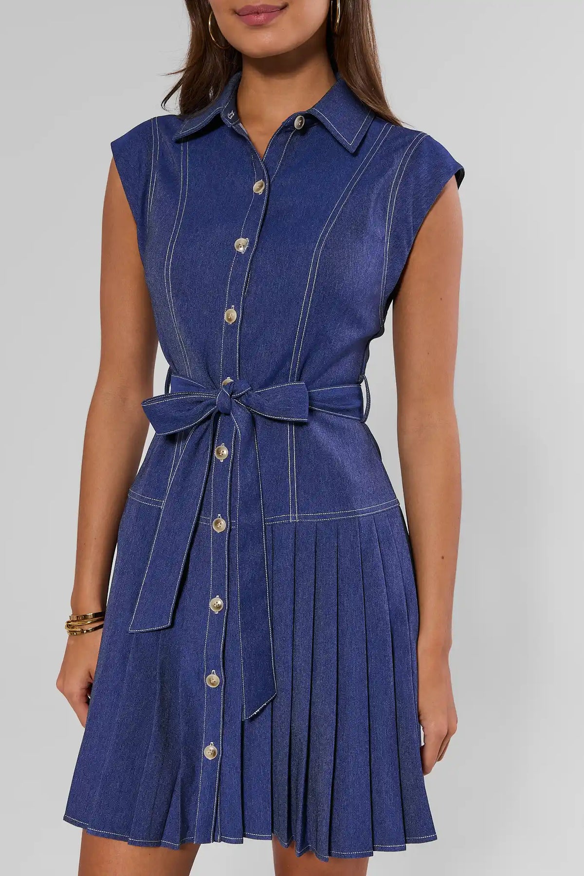 Edie Denim Pleated Button Up Dress with point collar, tie belt, and pleated skirt - Close-Up Front | Avara