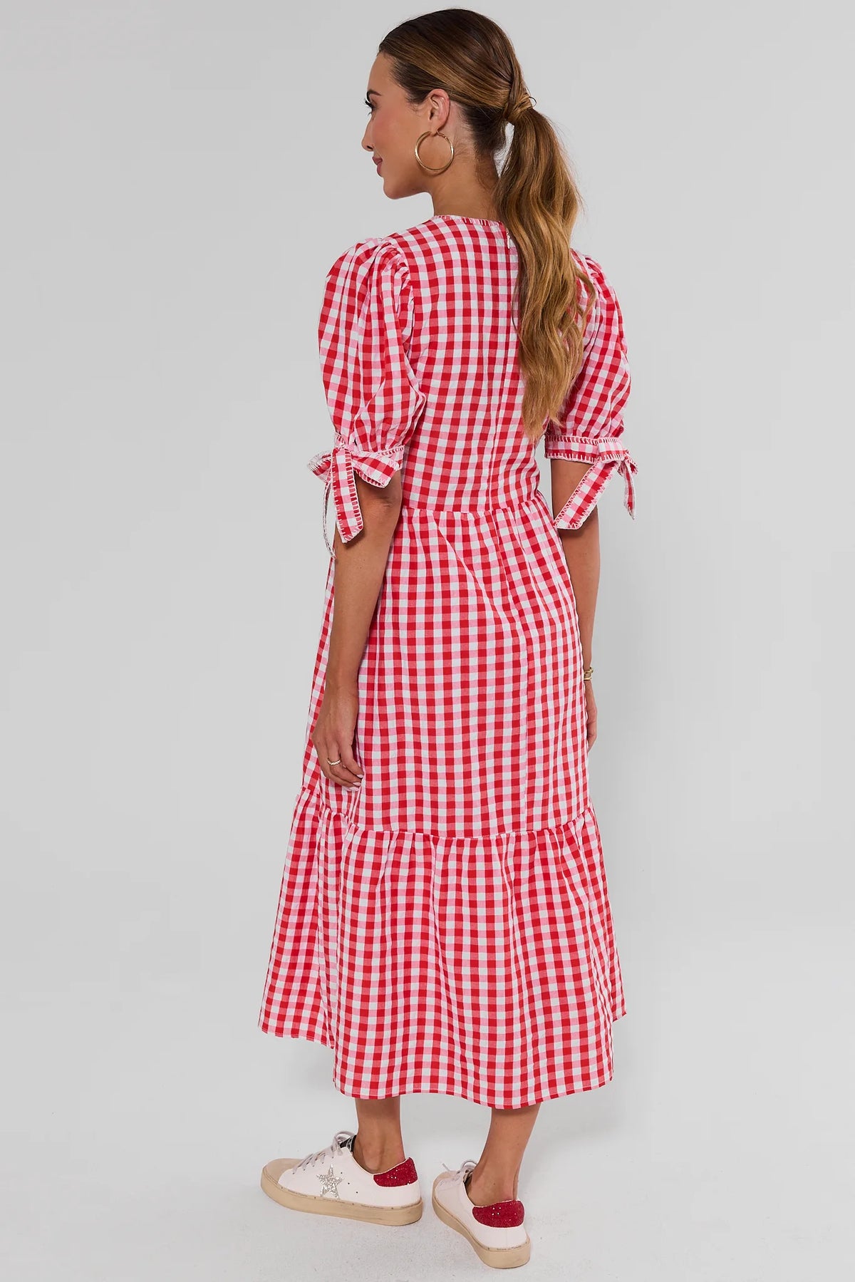 Hazel Red Gingham Midi Dress back view showing tiered skirt, puff sleeves with tie cuffs, and midi coverage | Avara