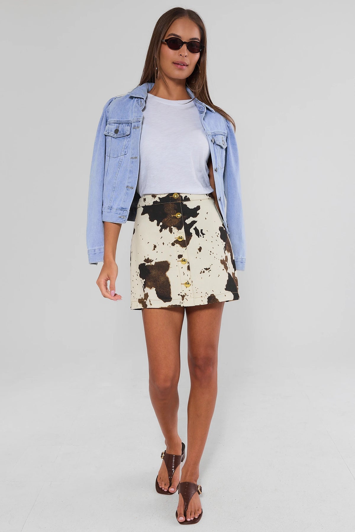 Ivory Cow Print Mini Skirt - Full Body Styled Look with Light Wash Denim Jacket | Avara