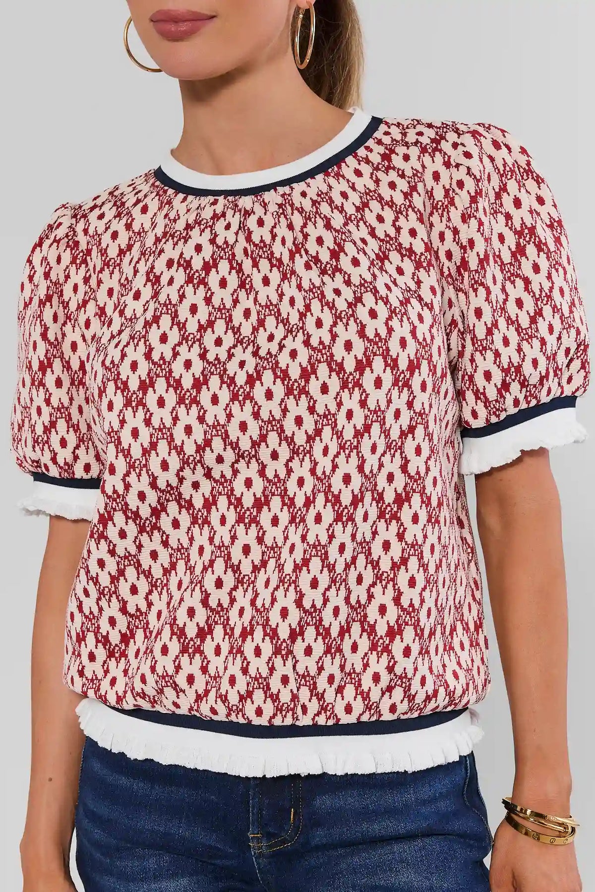 Rust Floral Print Top with Navy Contrast Trim & Ruffle Hem - Close-Up Detail | Avara