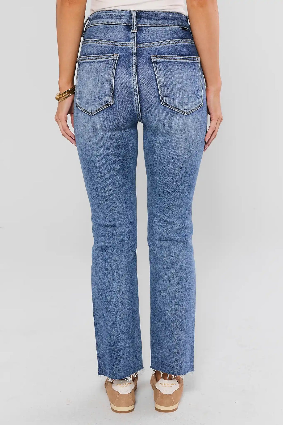 Aliyah Light Wash Kick Flare Jeans - Back View with Raw Hem Detail | Avara