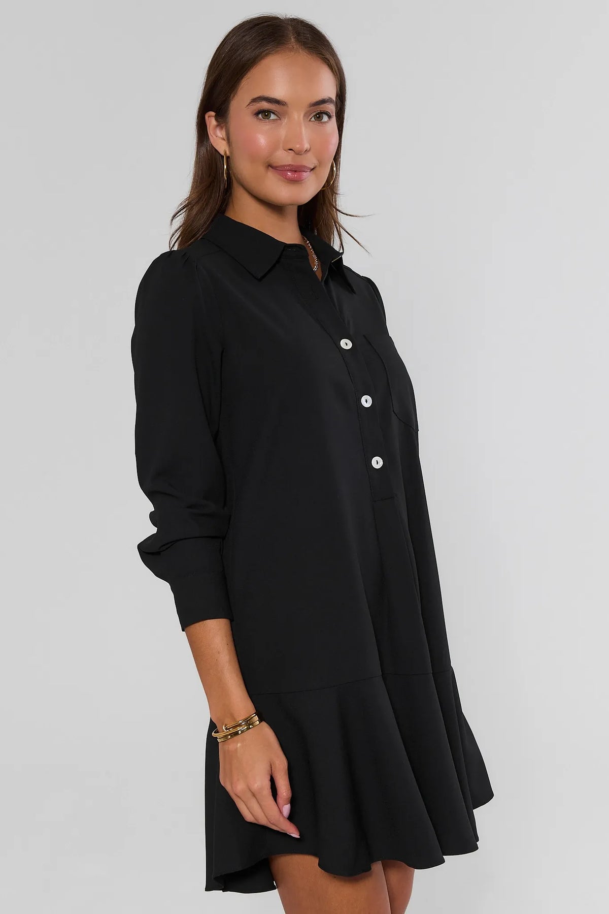 Black Drop Waist Ruffle Hem Dress - Side Profile On Model | Avara