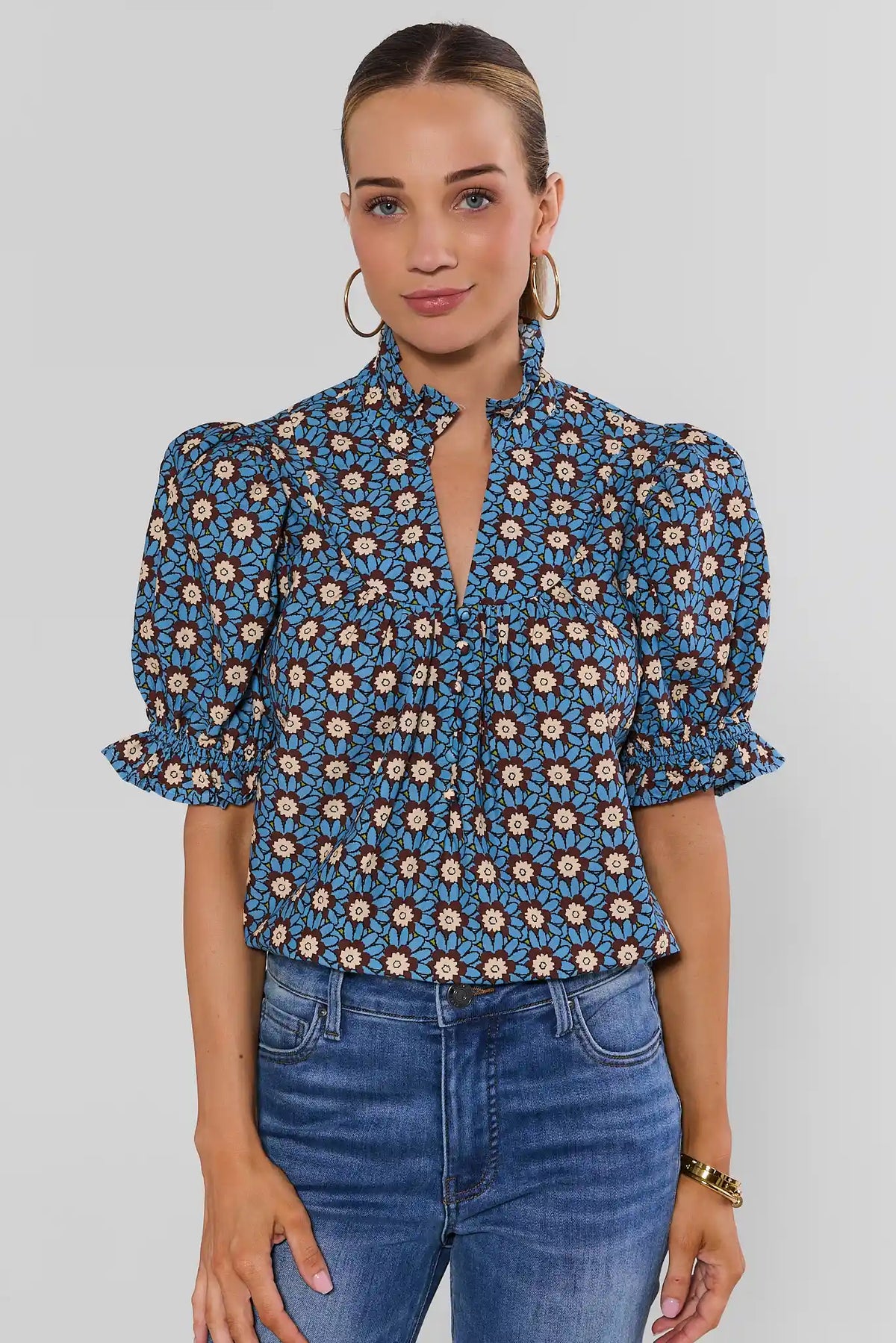 Blue Floral Print Marta Top - Front View On Model with Puff Sleeves, Ruffle Neck & Keyhole | Avara