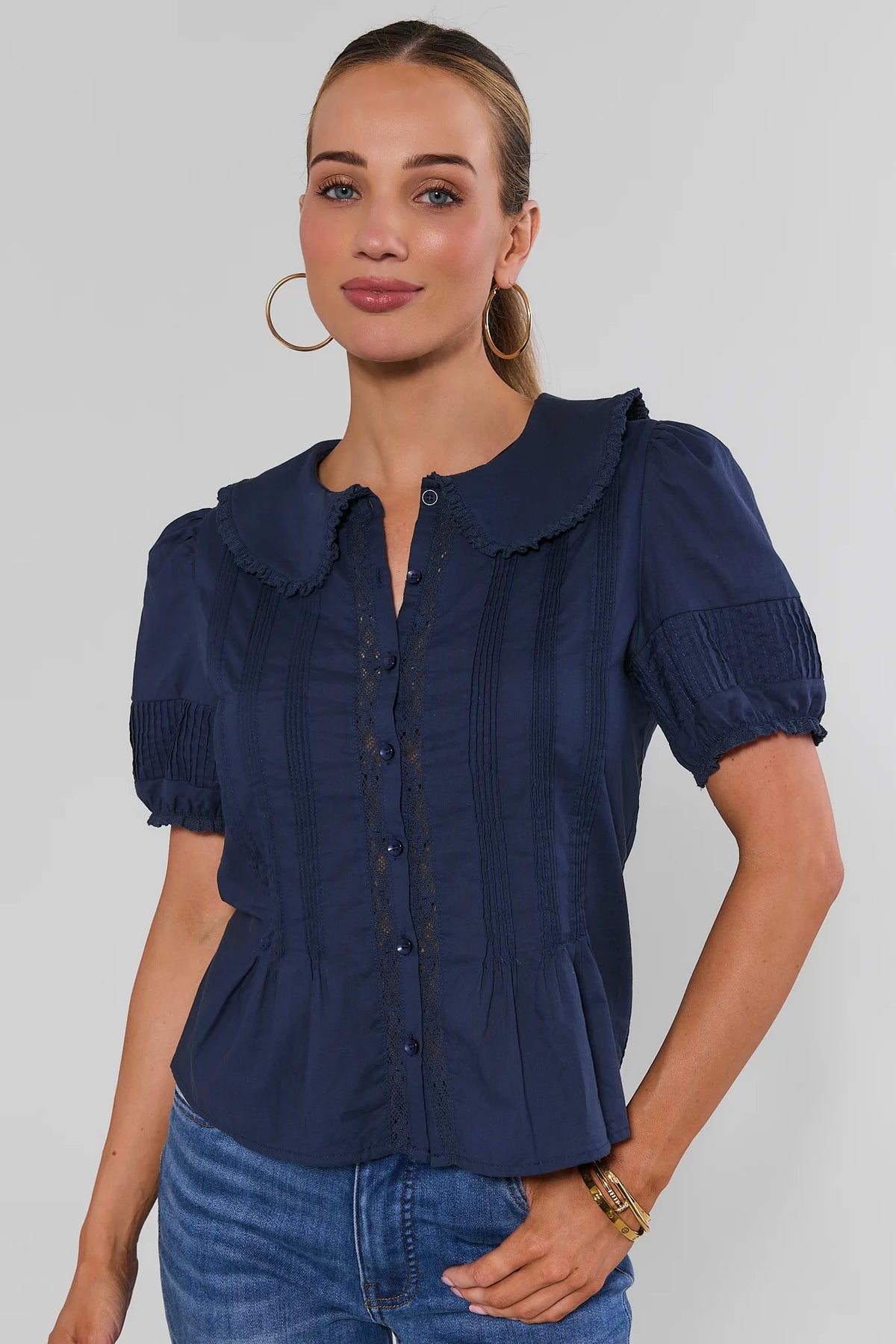 Navy Button-Up Top with Ruffle Collar - Front Three-Quarter View | Avara