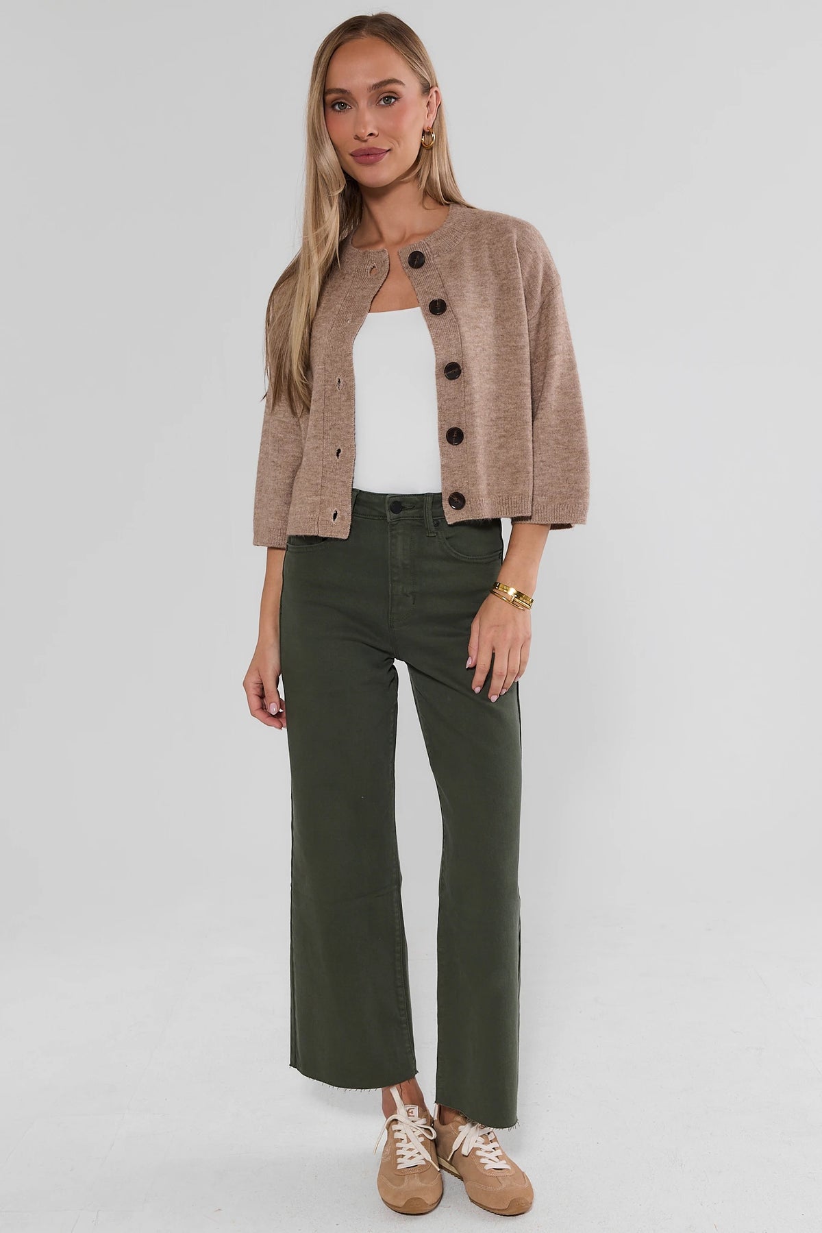 Kimberly Dark Olive Wide Leg Jeans Styled with Tan Cardigan & Sneakers - Full Length On Model | Avara
