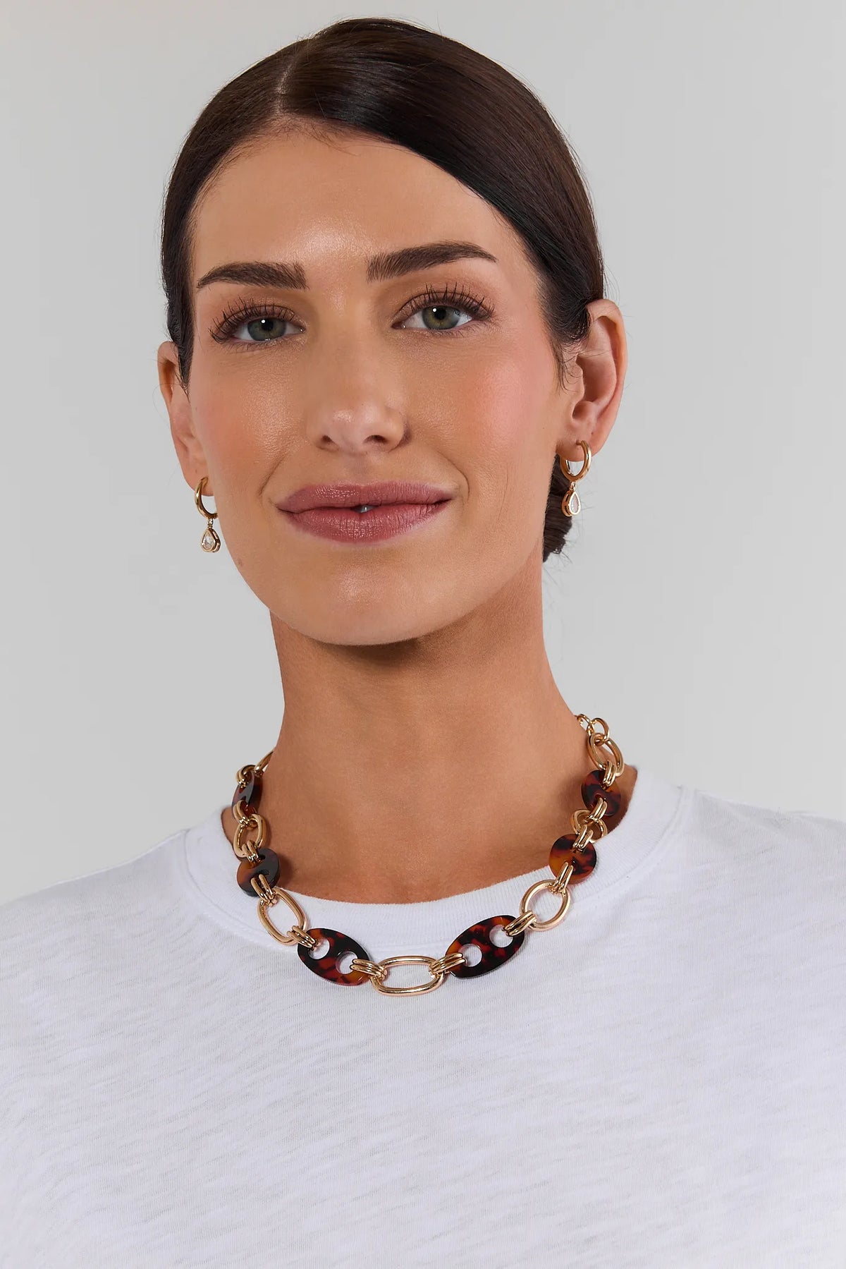 Tortoise Loop Chain Necklace On Model with White Top - Front View | Avara
