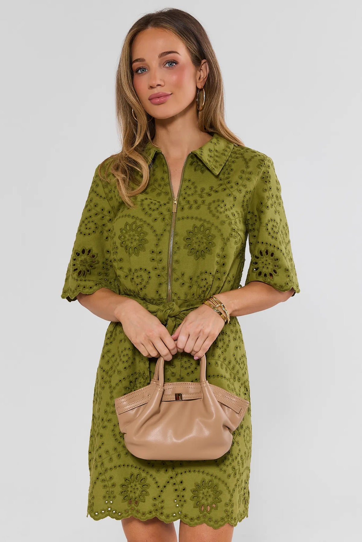 Tan Slouchy Crossbody Bag Held by Model - Front Styled Look | Avara