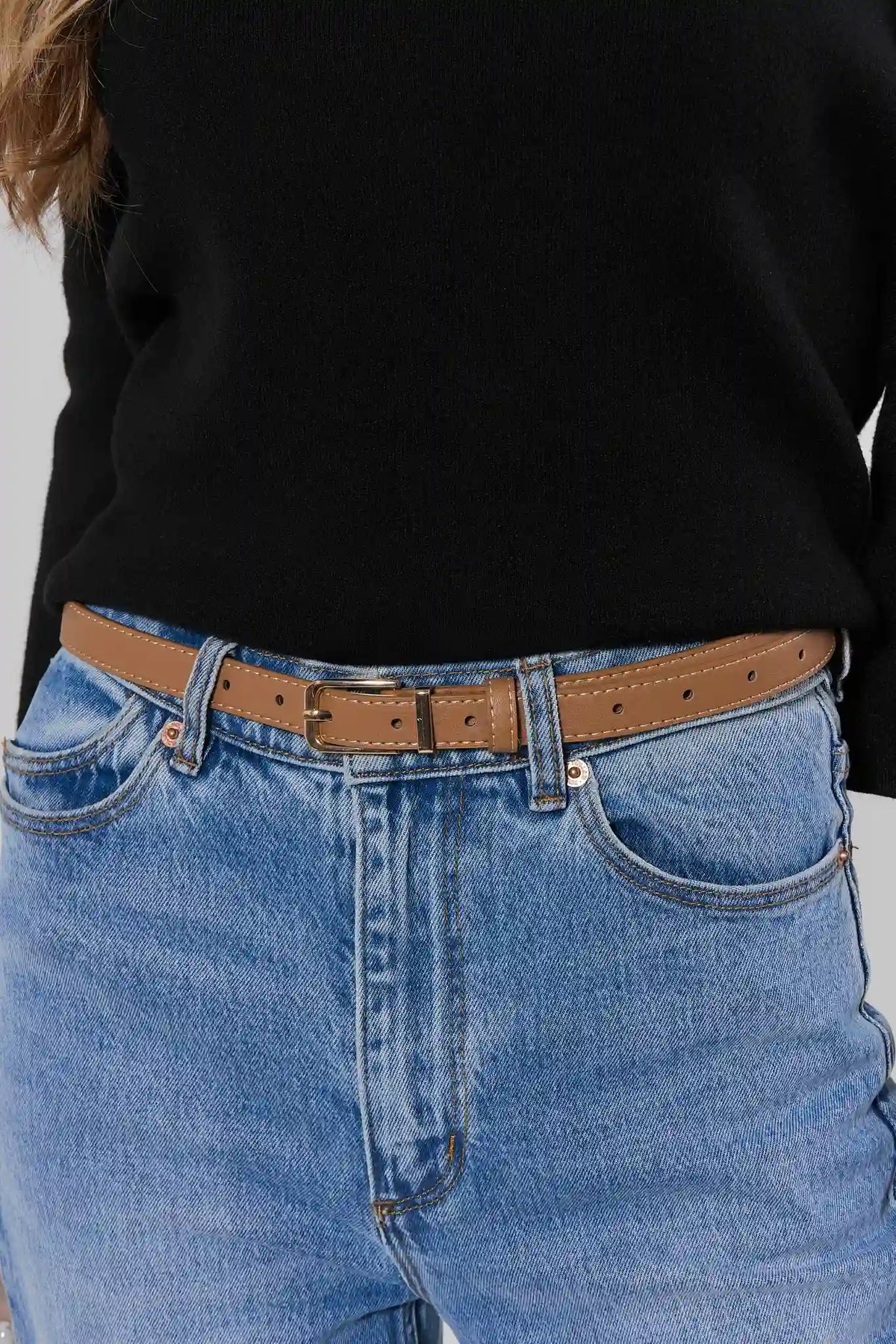 Tan Faux Leather Skinny Belt Styled on Model with Jeans - On-Model Waist Detail | Avara
