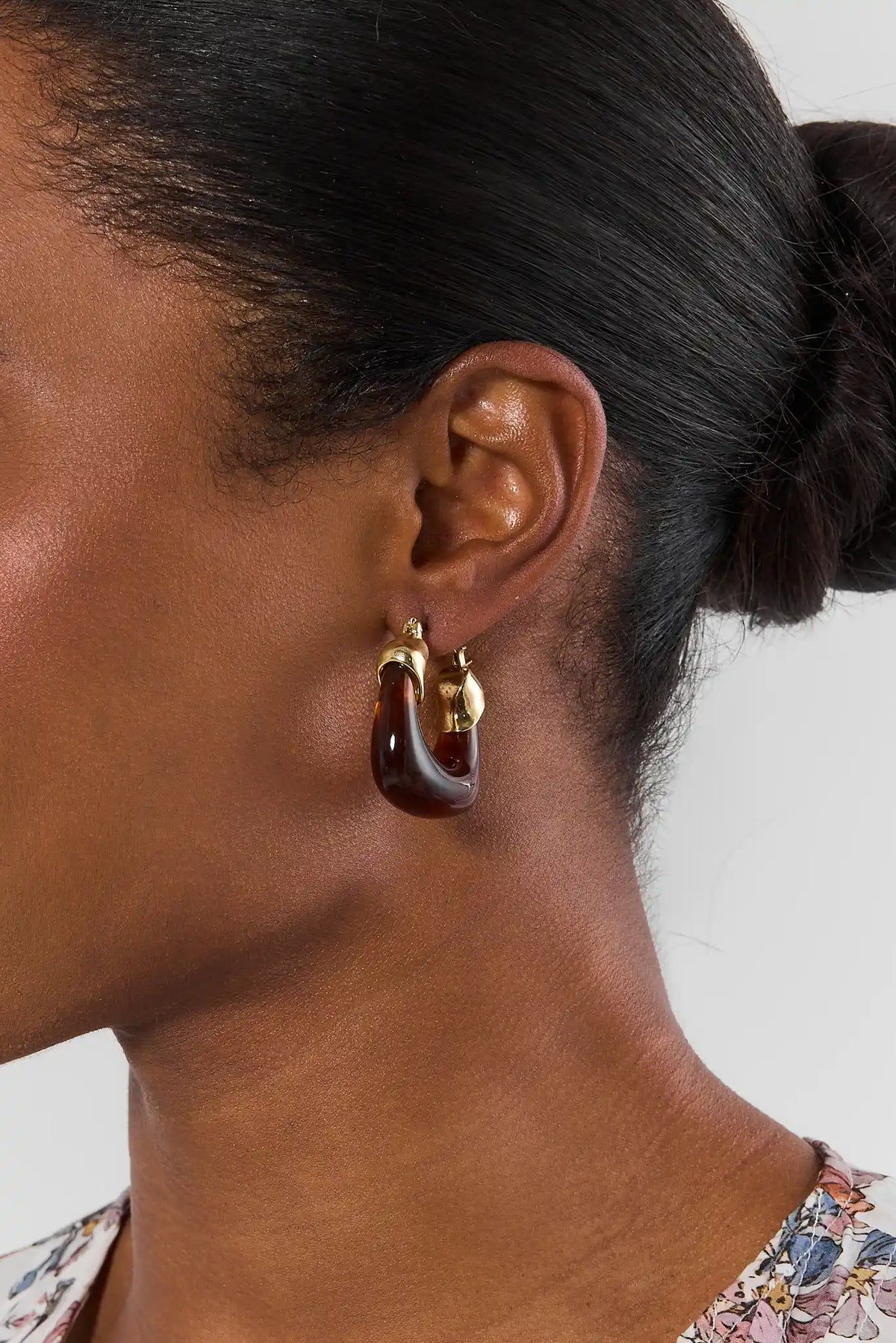 Tortoise Acrylic Hoop Earring with Gold Hardware - Close-Up On Model | Avara