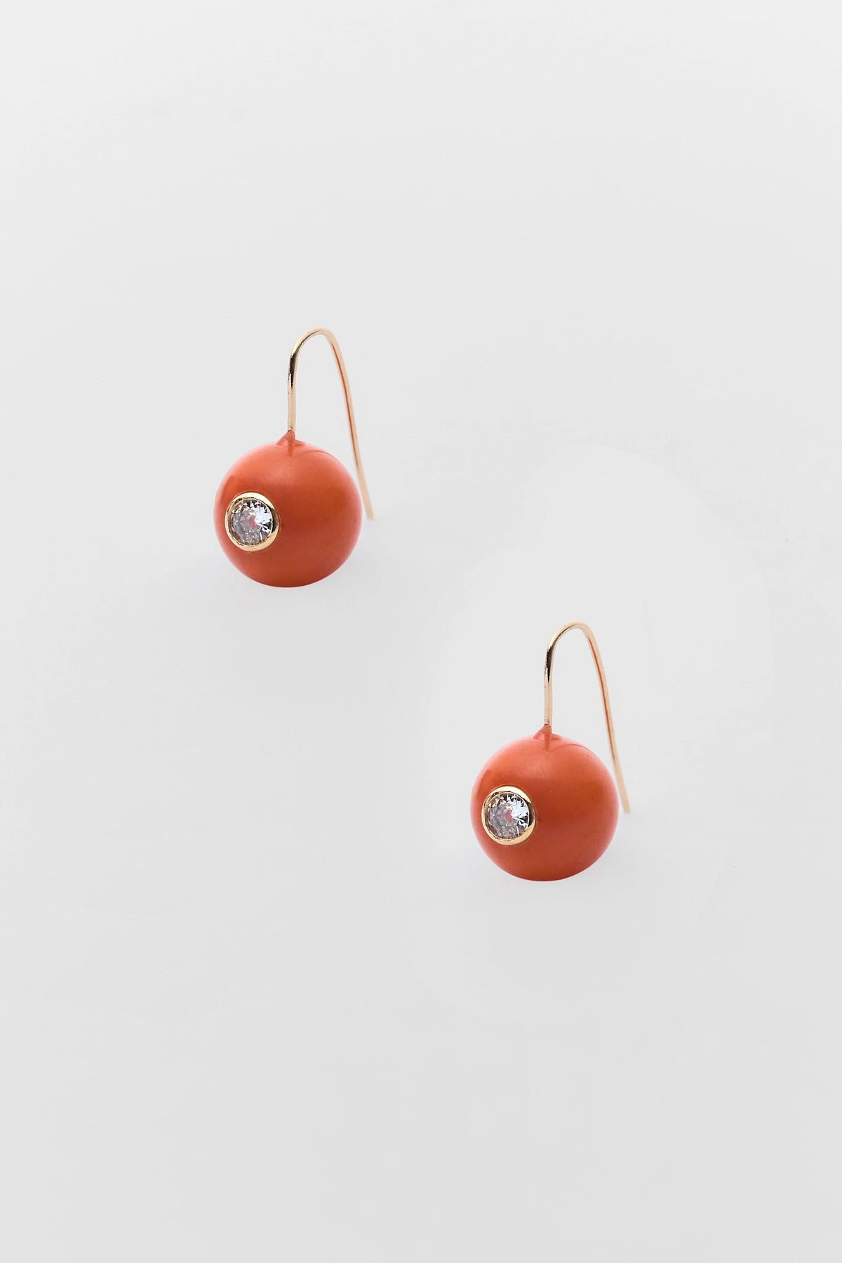 Orange Acrylic Circle Drop Earrings with Rhinestone Center - Flat Lay | Avara