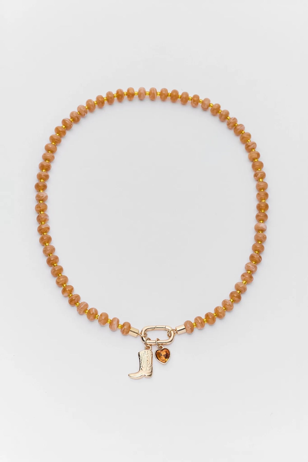 Orange Beaded Boot Charm Necklace with Gold-Tone Boot & Heart Pendants - Flat Lay | Avara