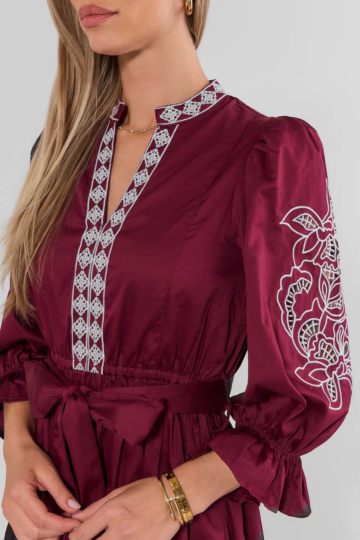 Burgundy Embroidered Midi Dress - Close-Up Detail, Floral Sleeve & White Embroidery Trim | Avara