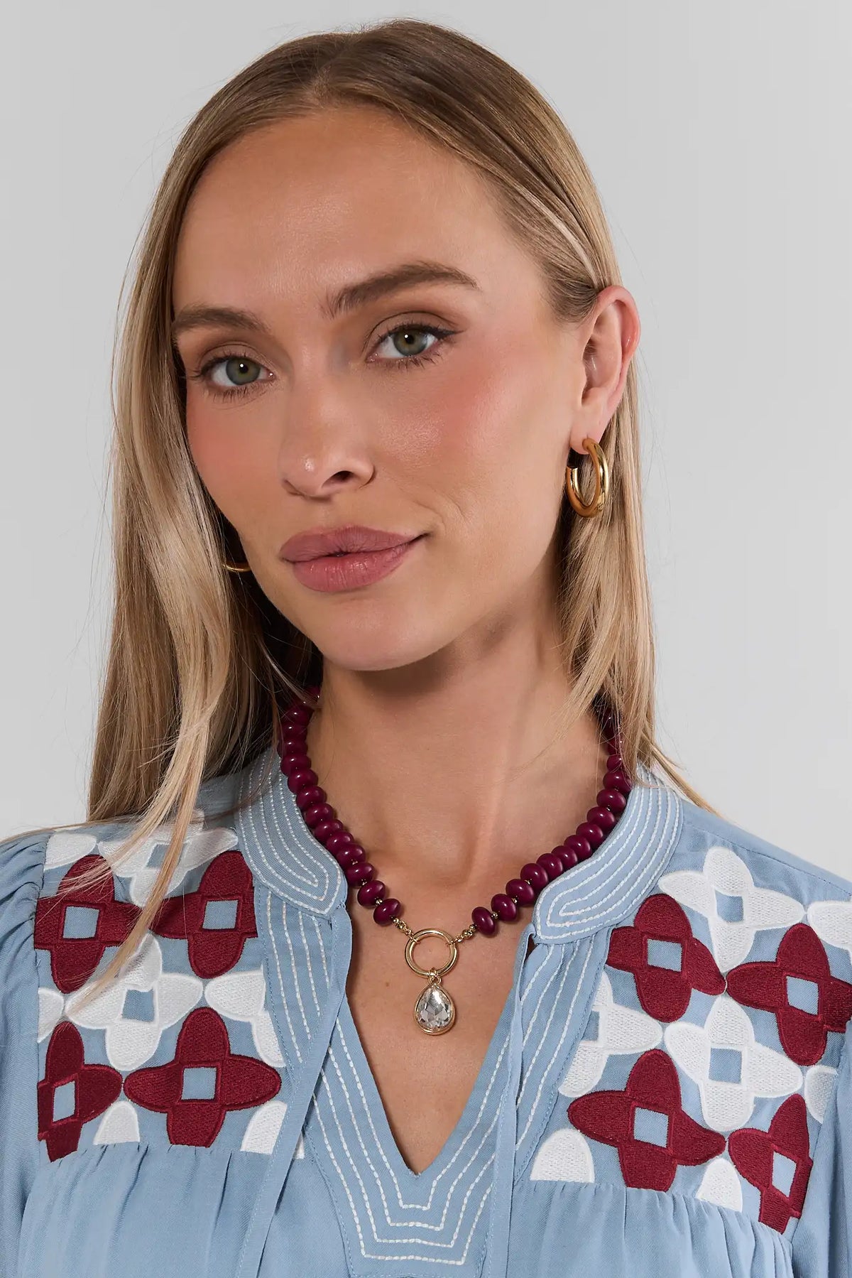 Burgundy Beaded Necklace with Gold Rhinestone Charm - On Model | Avara