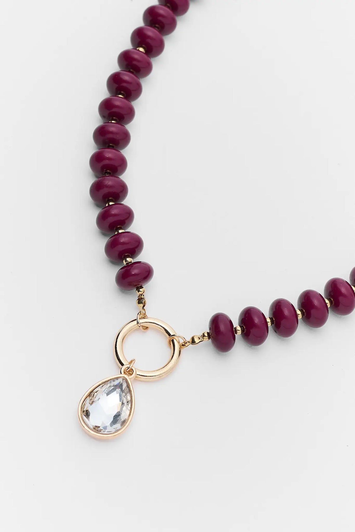 Burgundy Bead Necklace Gold Teardrop Rhinestone Charm - Close-Up Detail | Avara