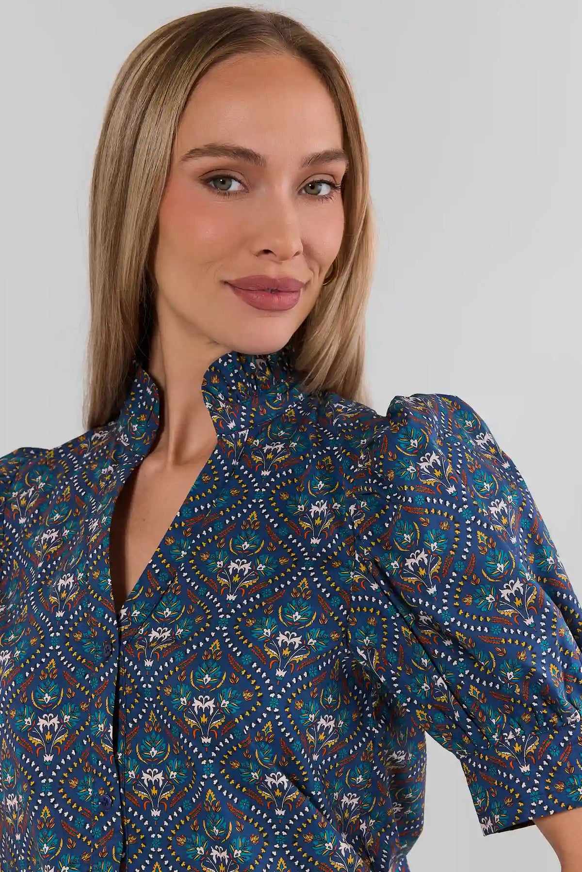 Navy Printed Puff Sleeve Top - Split Neckline Close-Up, Three-Quarter Angle On Model | Avara