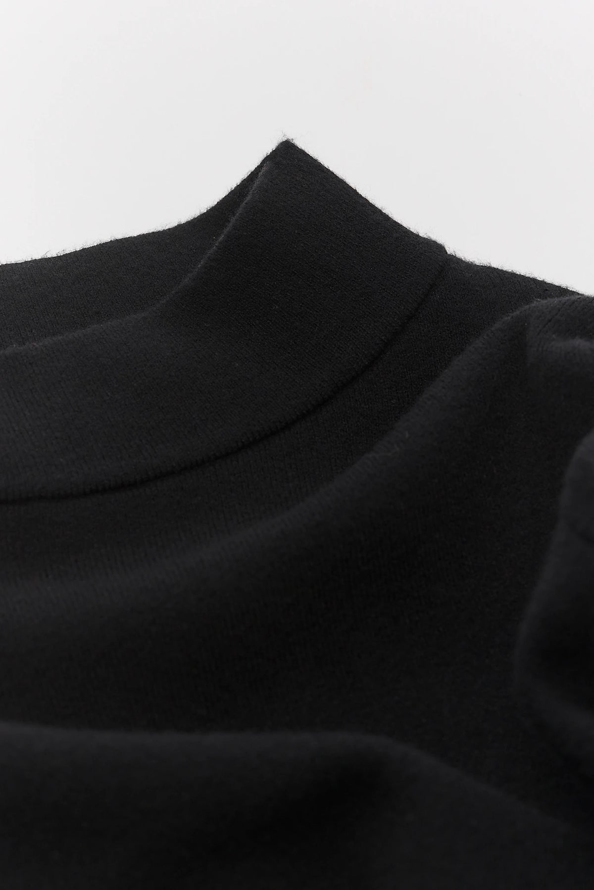 Jackie Black Knit Sweater - Mock Neckline Close-Up, Soft Knit Fabric Texture Detail | Avara