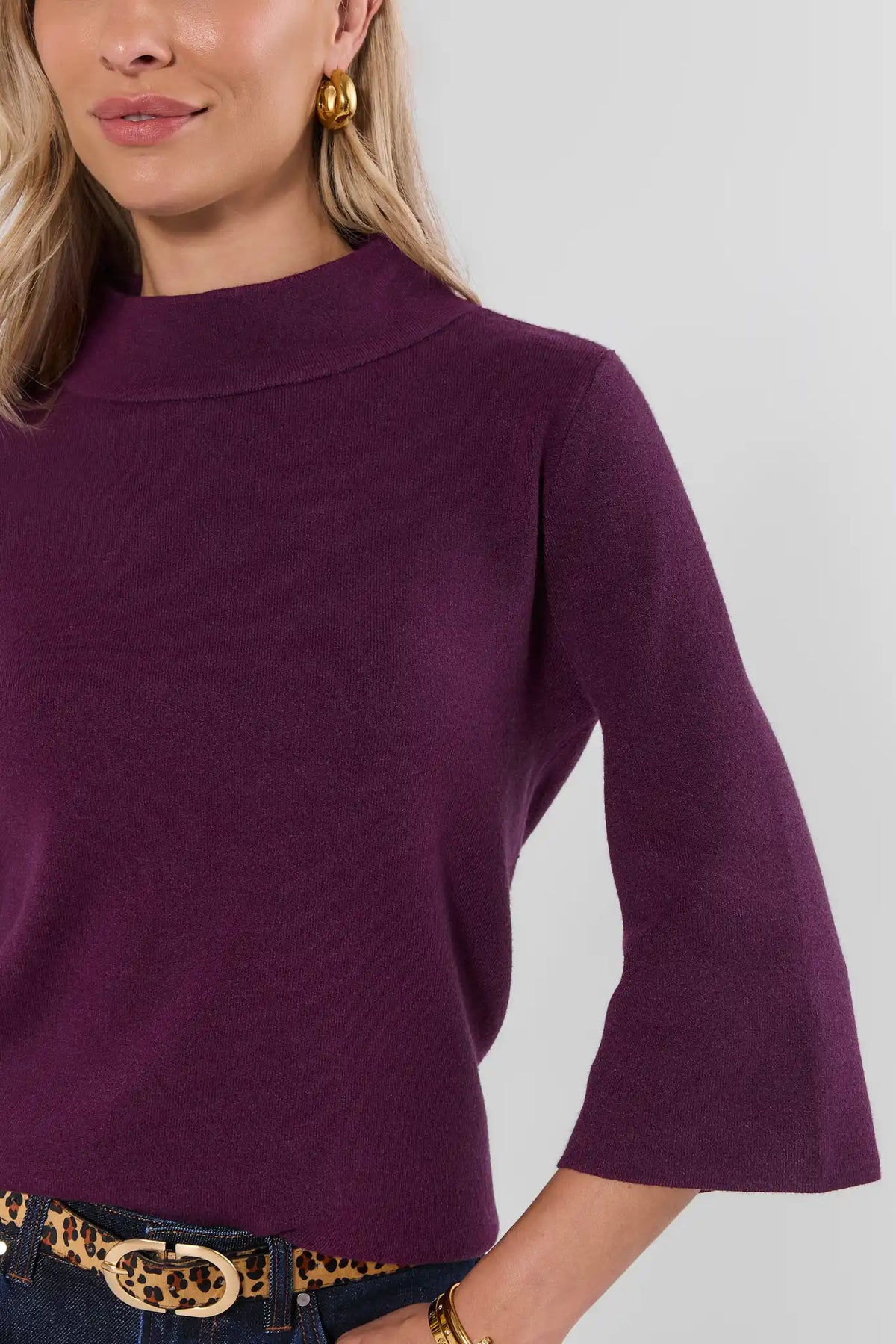 Plum Knit Sweater Mock Neck Bell Sleeve Close-Up Detail - Front Crop View with Leopard Belt | Avara