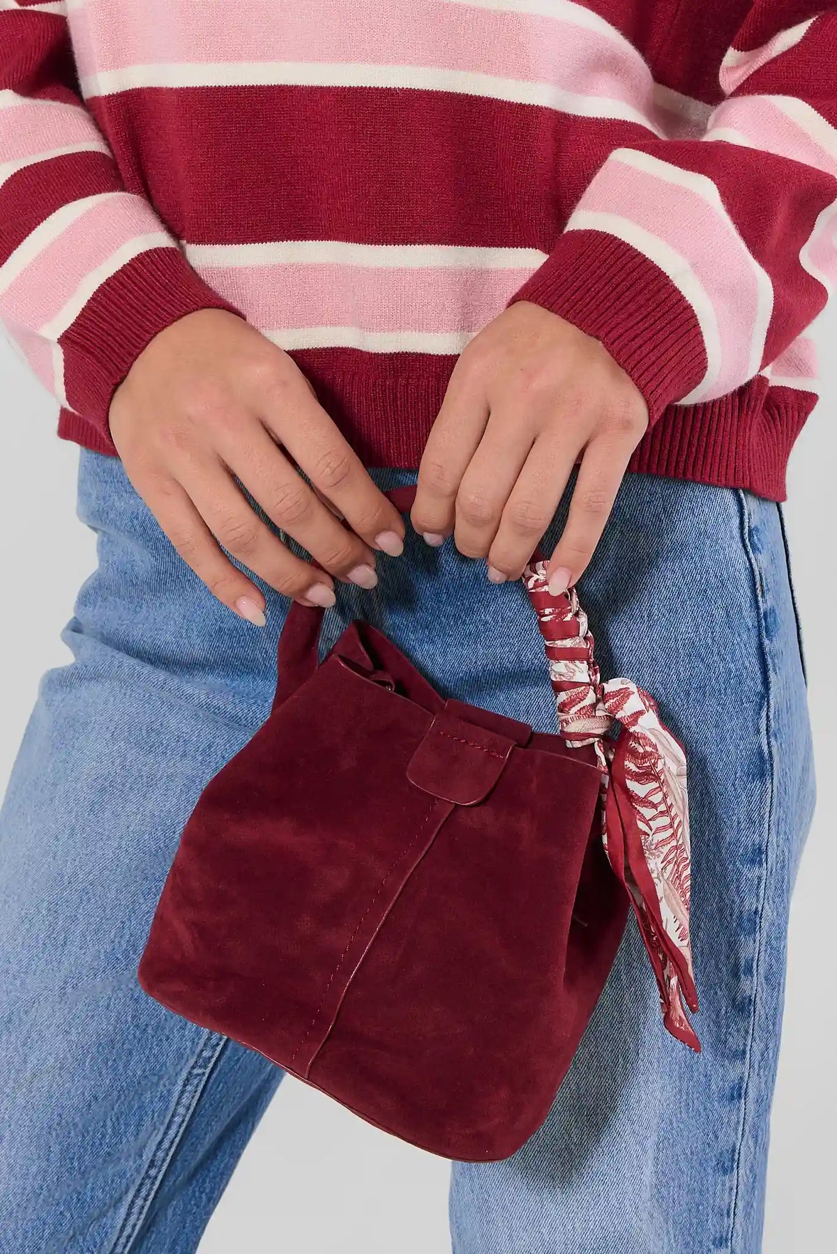 Burgundy Faux Suede Bag Styled with Denim - On Model Detail | Avara