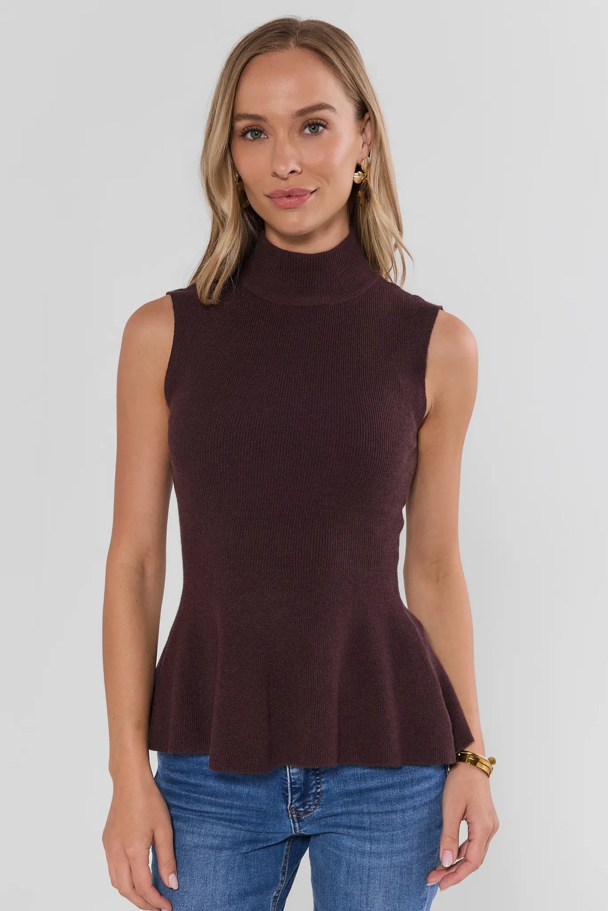 Brown Knit Sleeveless Turtleneck Peplum Top - Front View On Model | Avara