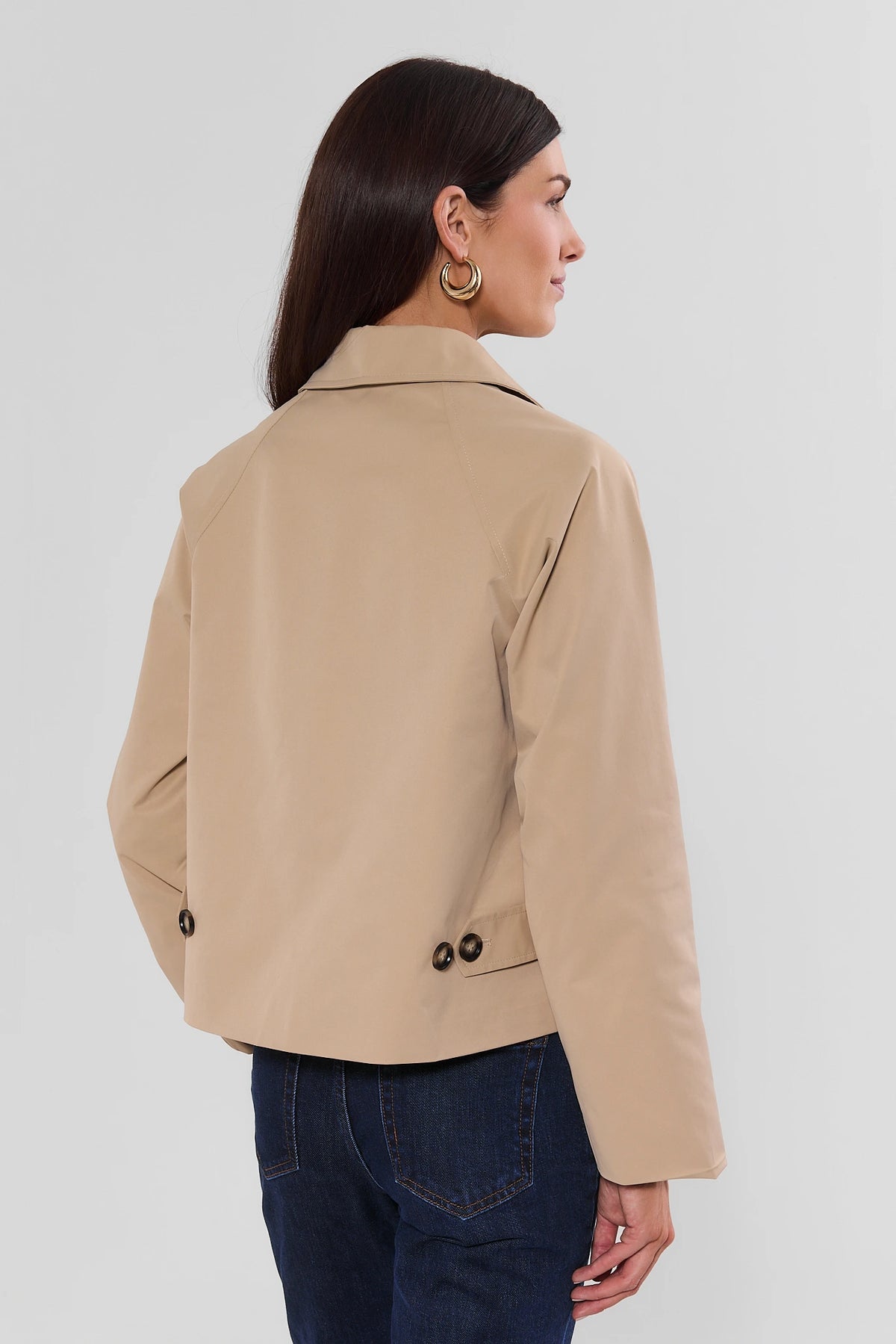 Tan Short Trench Jacket showing back hem button detail - Back View On Model | Avara
