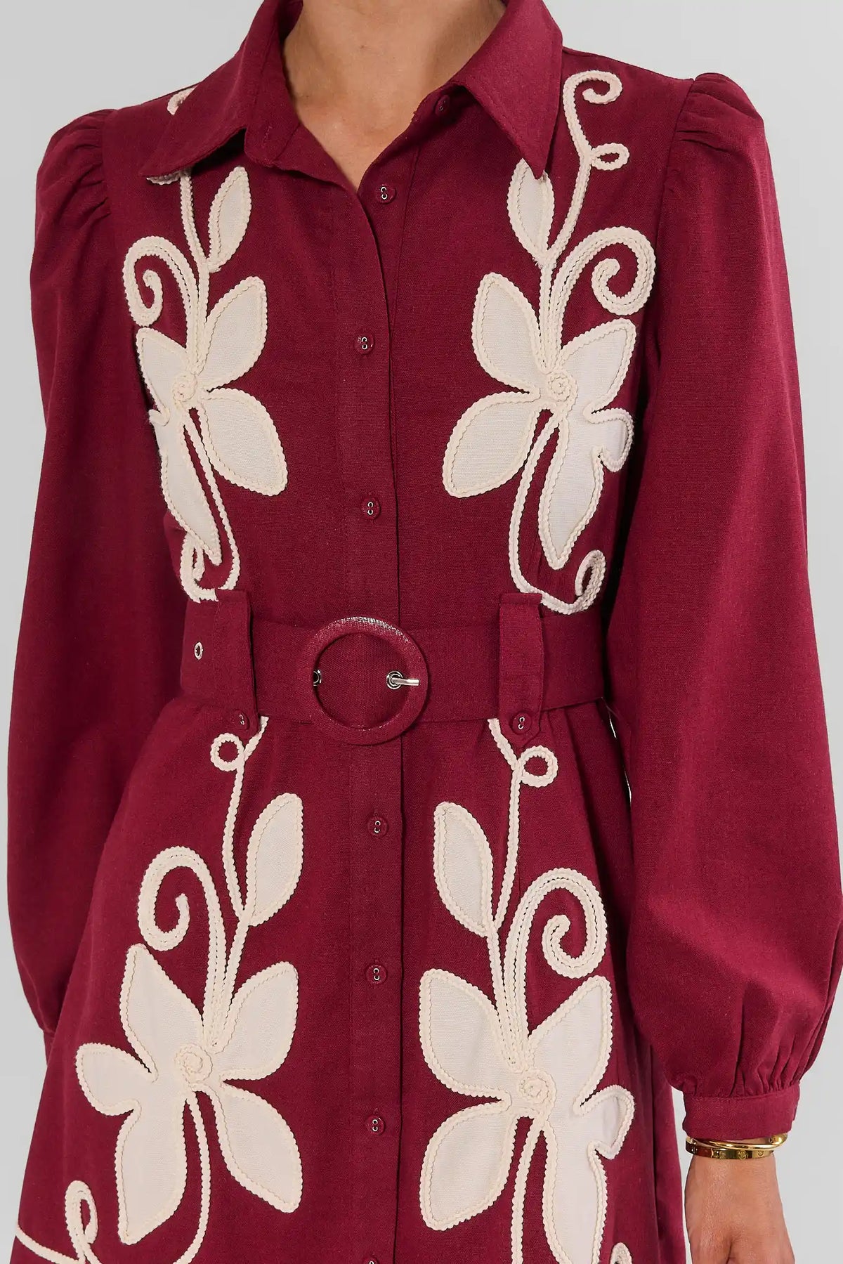 Burgundy Embroidered Dress Floral Appliqué & Belted Waist Close-Up | Avara