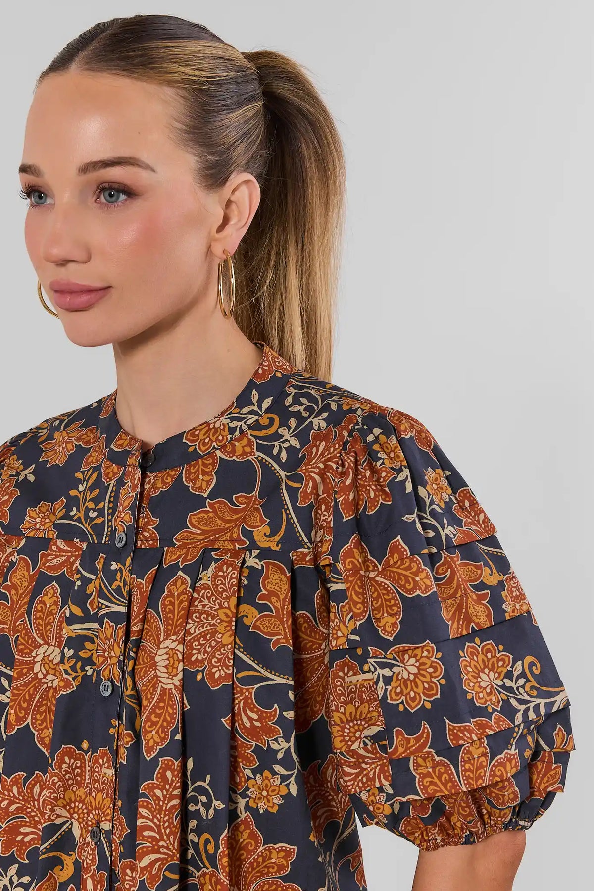 Navy Floral Puff Sleeve Top - Neckline & Puff Sleeve Close-Up Detail On Model | Avara
