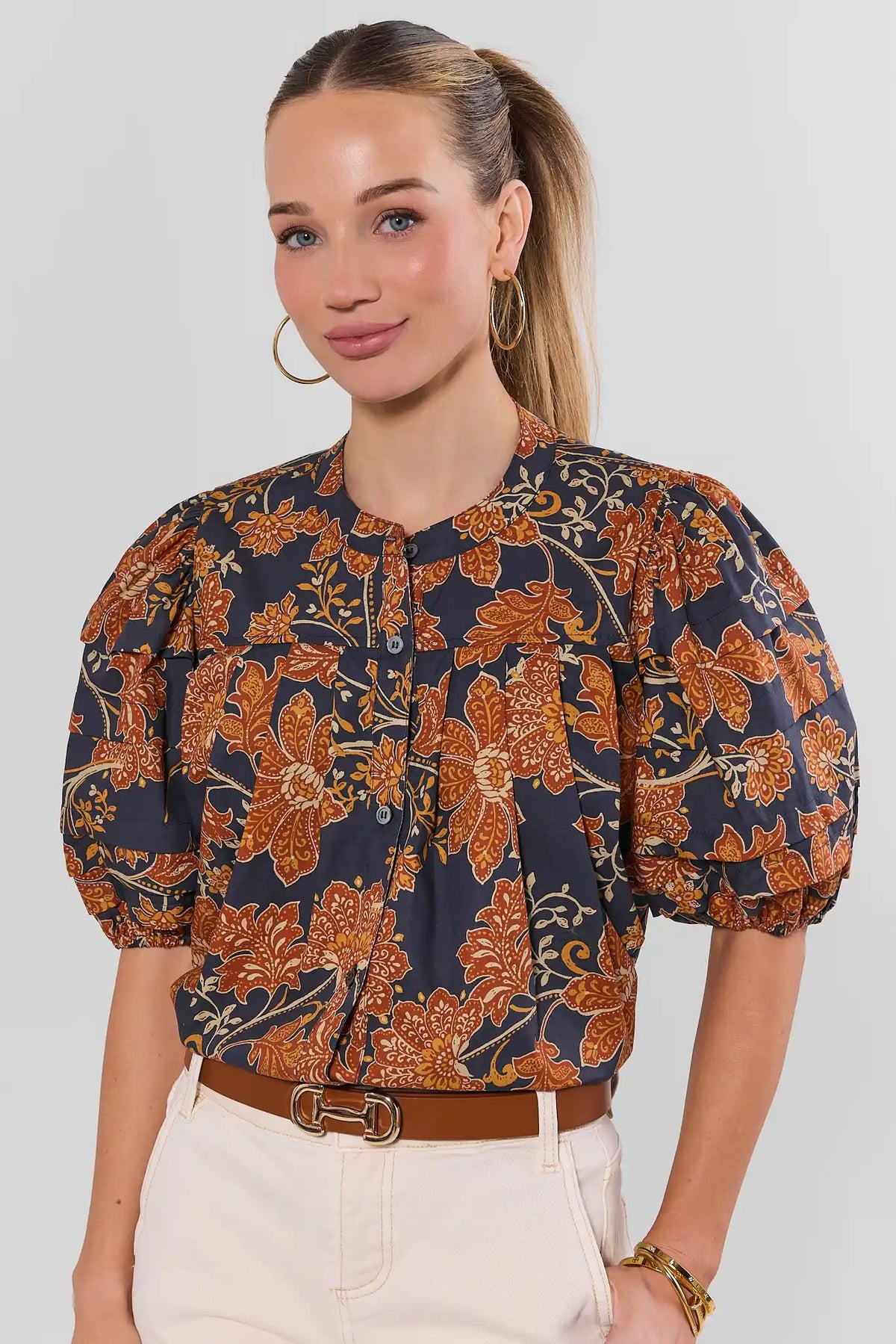 Navy Floral Printed Puff Sleeve Button-Up Top - Front View On Model with Belt | Avara