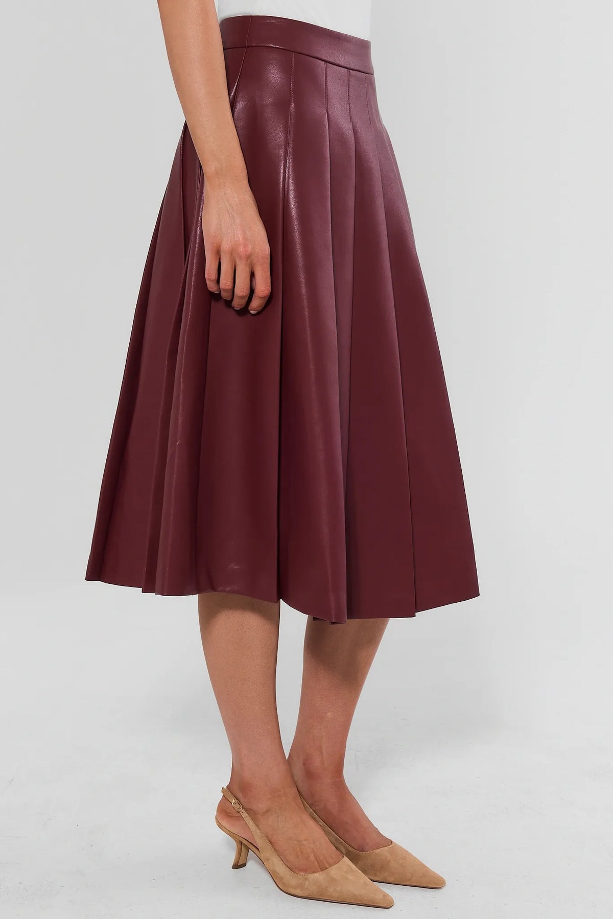 Maroon Faux Leather Pleated Midi Skirt - Side Profile High Waist & Pleat Detail | Avara