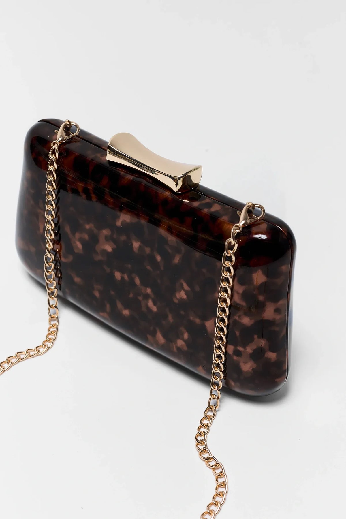 Brown Tortoise Enamel Clutch - Angled Side View Showing Gold Clasp Hardware and Chain Detail | Avara