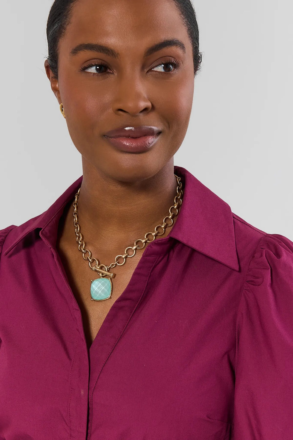 Gold Toggle Necklace with Mint Faceted Stone Pendant - On Model Front View | Avara