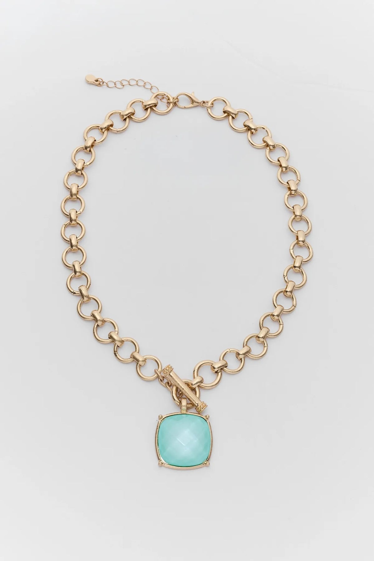 Gold Faceted Stone Toggle Necklace with Mint Green Pendant - Flat Lay | Avara