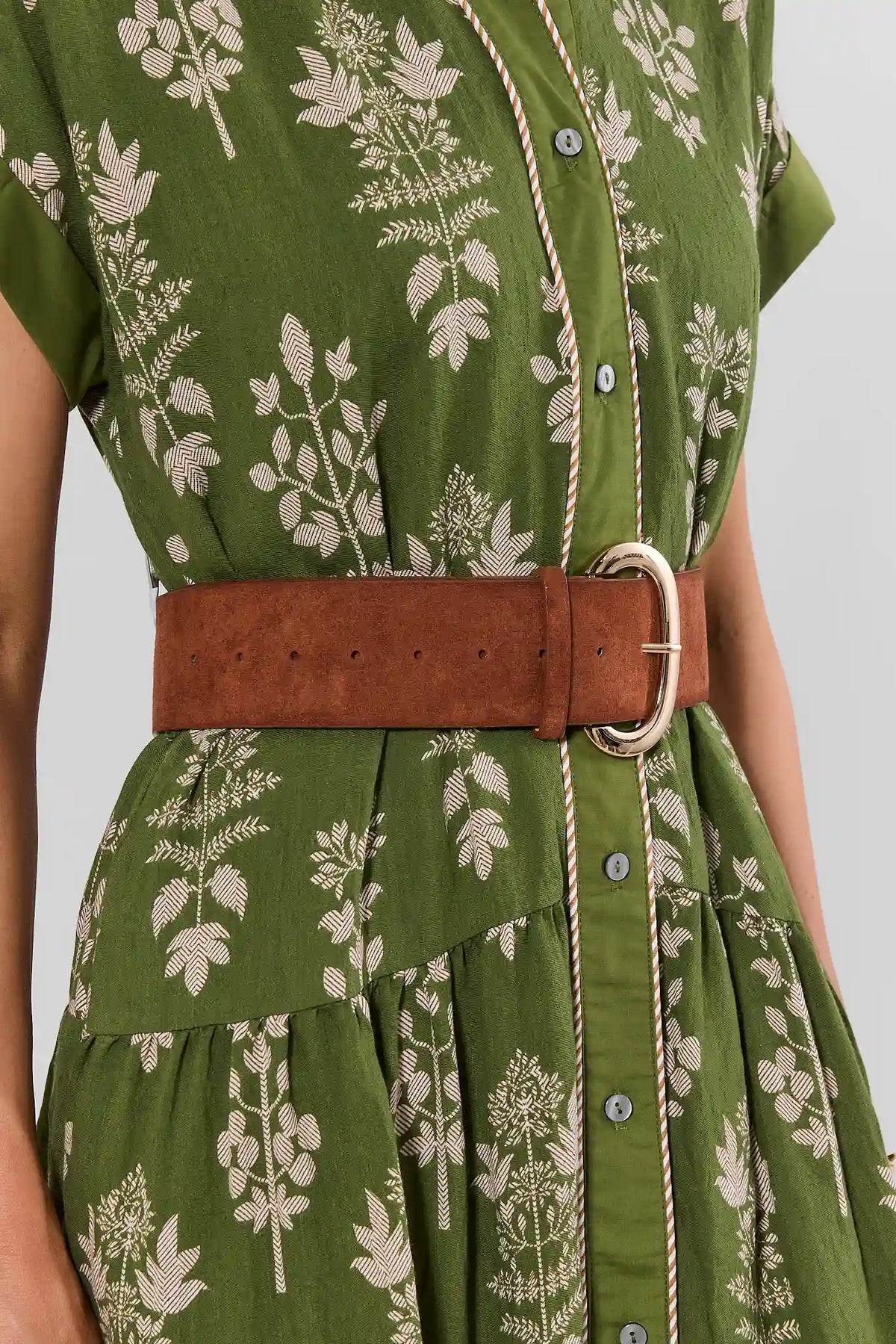 Brown Oval Buckle Wide Belt Styled on Model Over Green Floral Dress - Waist Detail | Avara