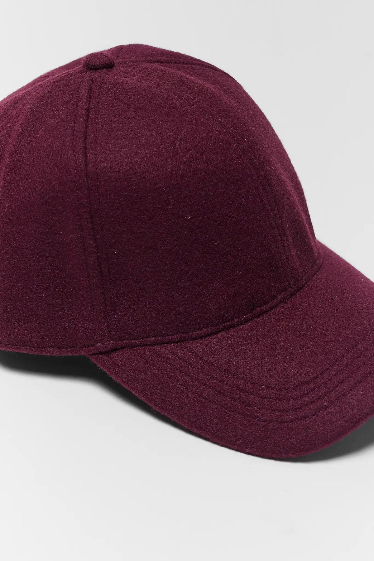 Burgundy Faux Wool Baseball Cap - Close-Up Fabric Texture Detail | Avara