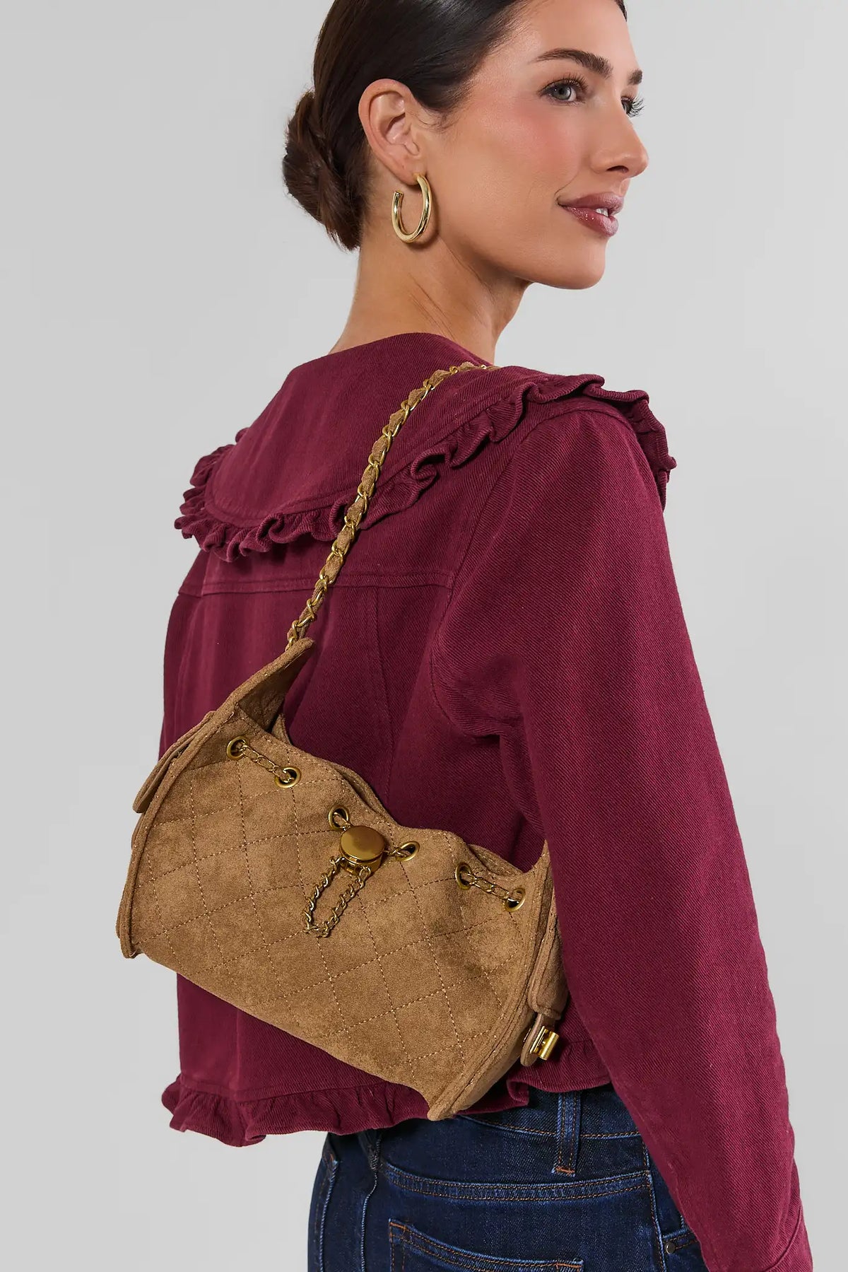 Tan Faux Suede Quilted Bucket Bag on Model - Side Profile with Gold Hardware | Avara