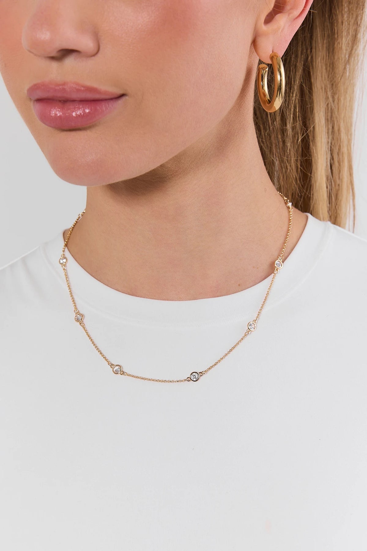Delicate Gold Rhinestone Necklace - On Model Styled with Gold Hoop Earrings | Avara