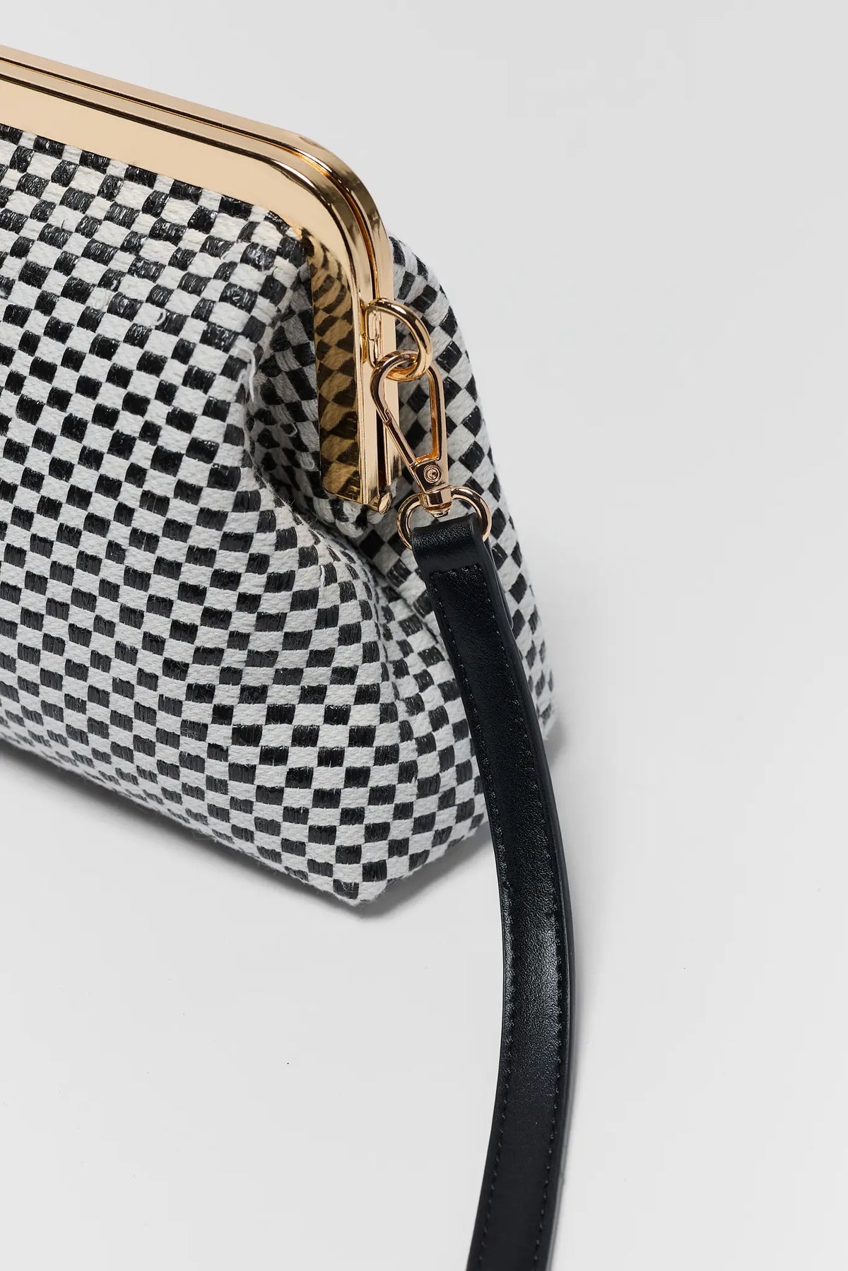 Black Woven Clutch Bag - Gold Strap Hardware and Crossbody Strap Attachment Detail | Avara