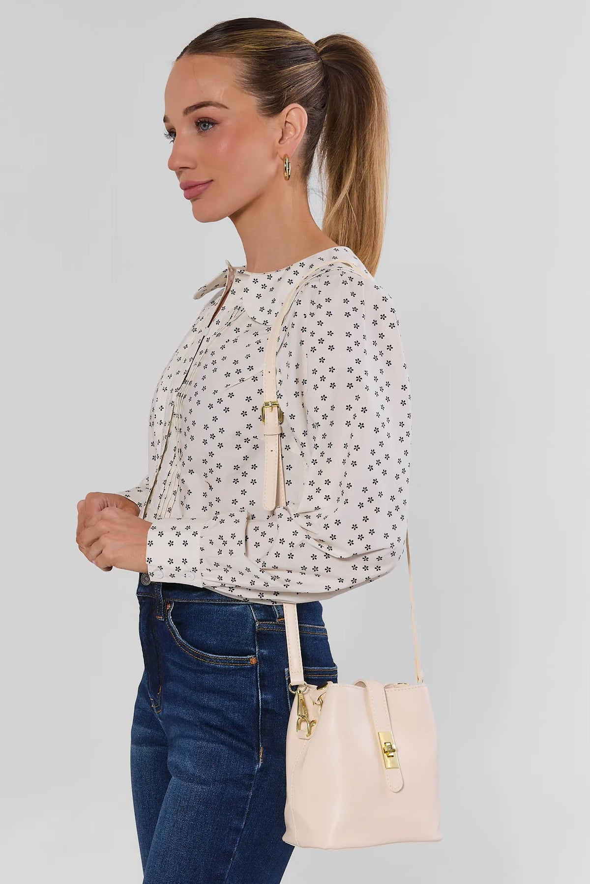 Ivory Turnlock Bucket Bag Worn as Crossbody - On Model Side Profile | Avara