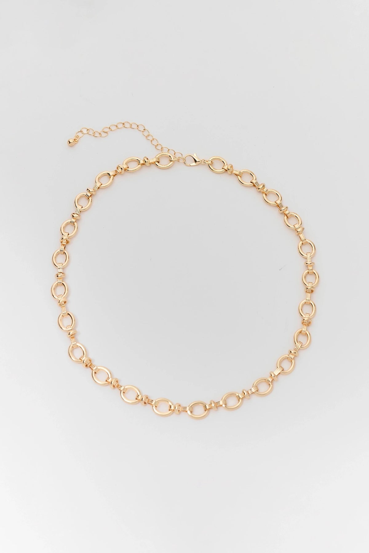 Gold Oval Chain Link Necklace - Flat Lay with Lobster Clasp Detail | Avara