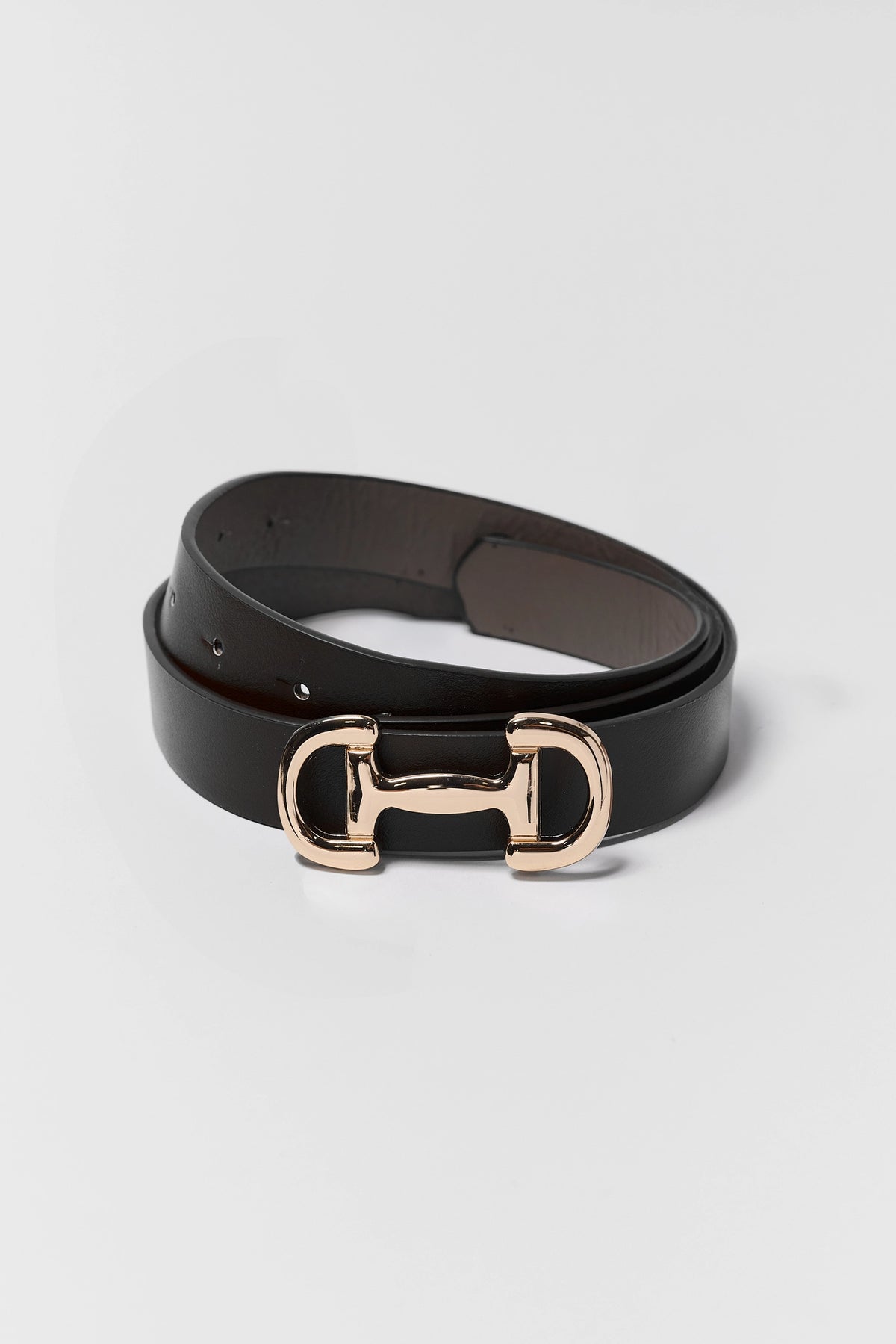 Black Faux Leather Horse Bit Buckle Belt - Coiled Flat Lay with Gold Hardware | Avara